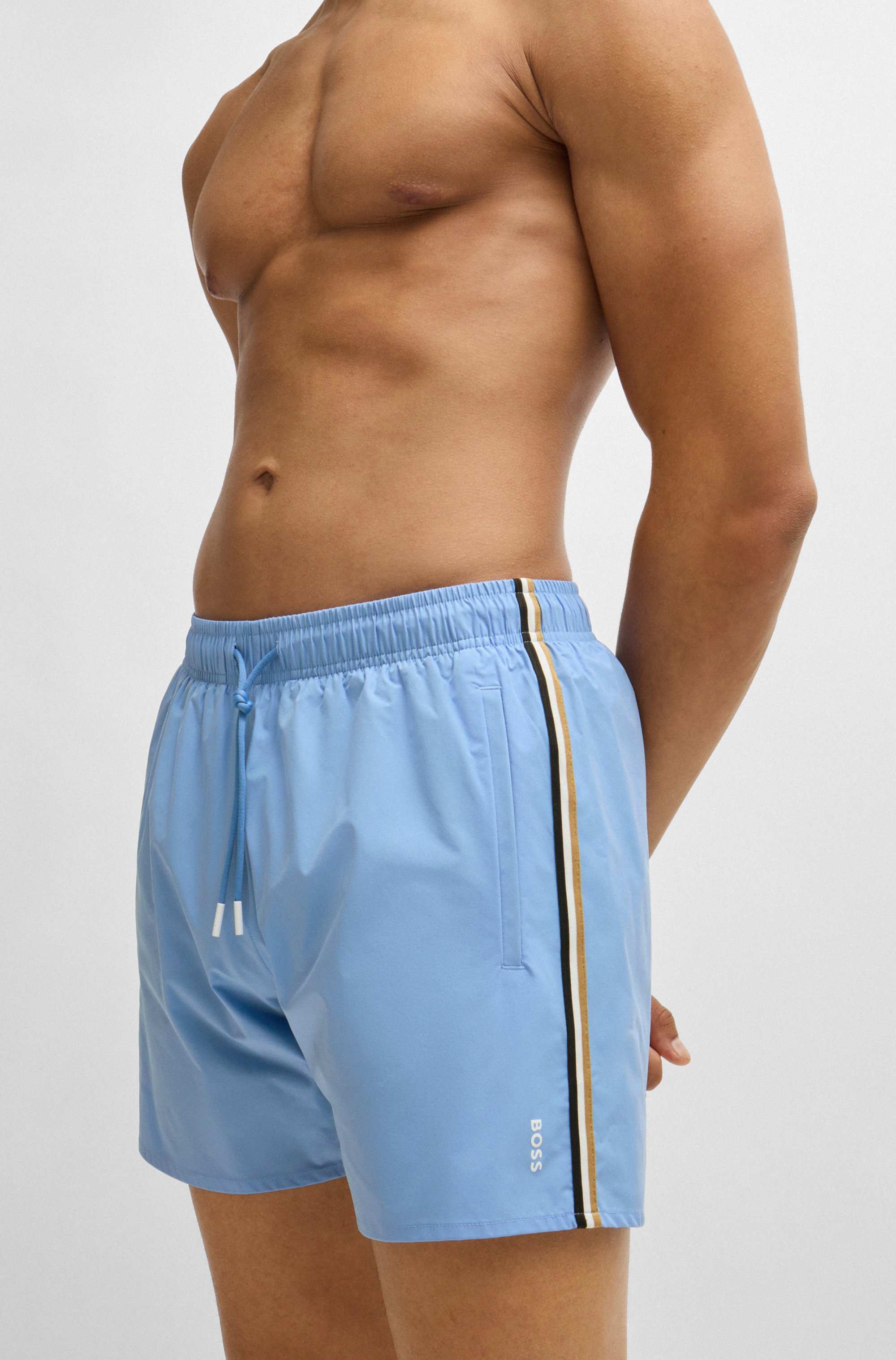 Fully lined swim shorts with signature stripe