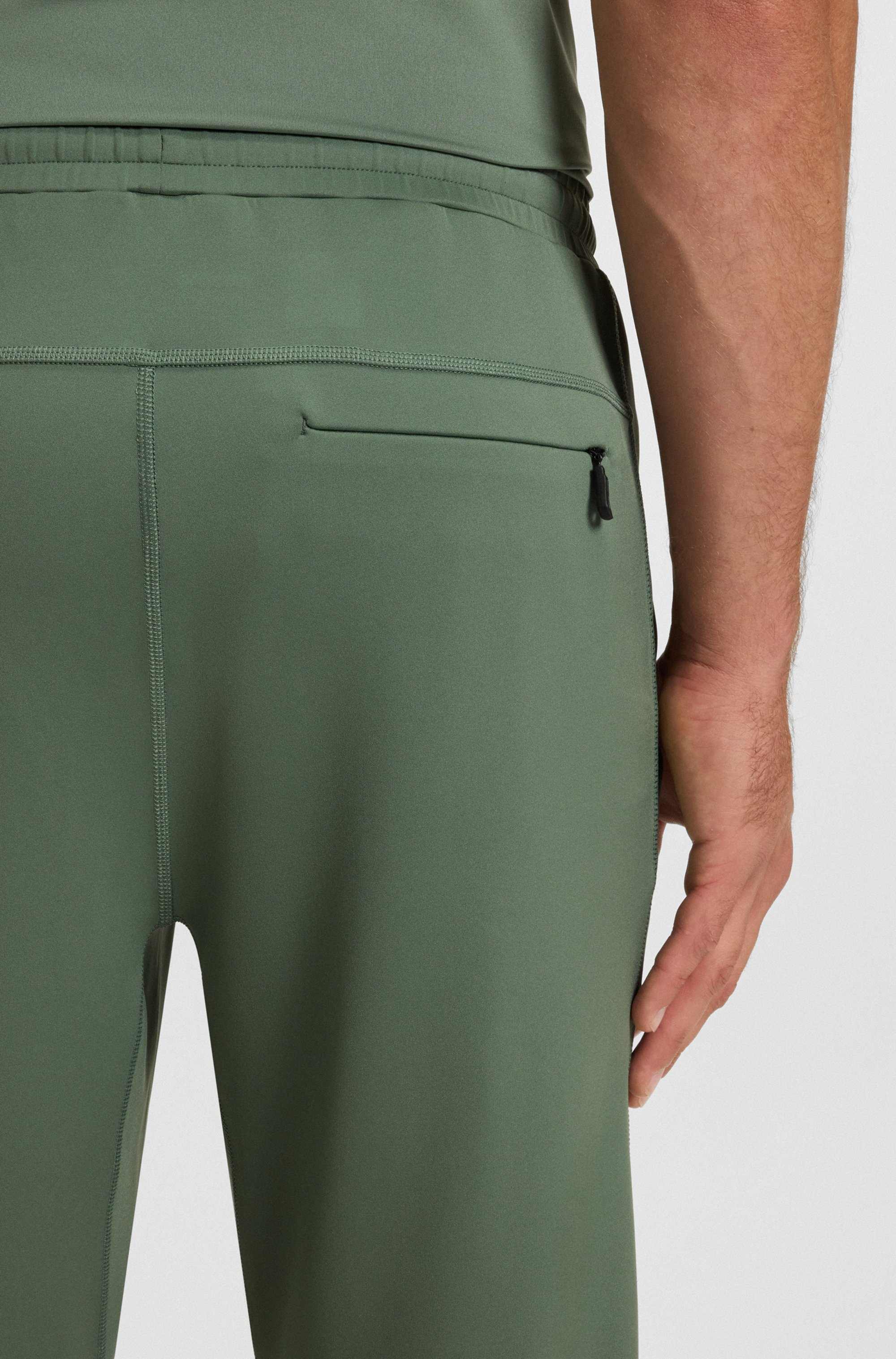 Quick-dry trousers with reflective branding
