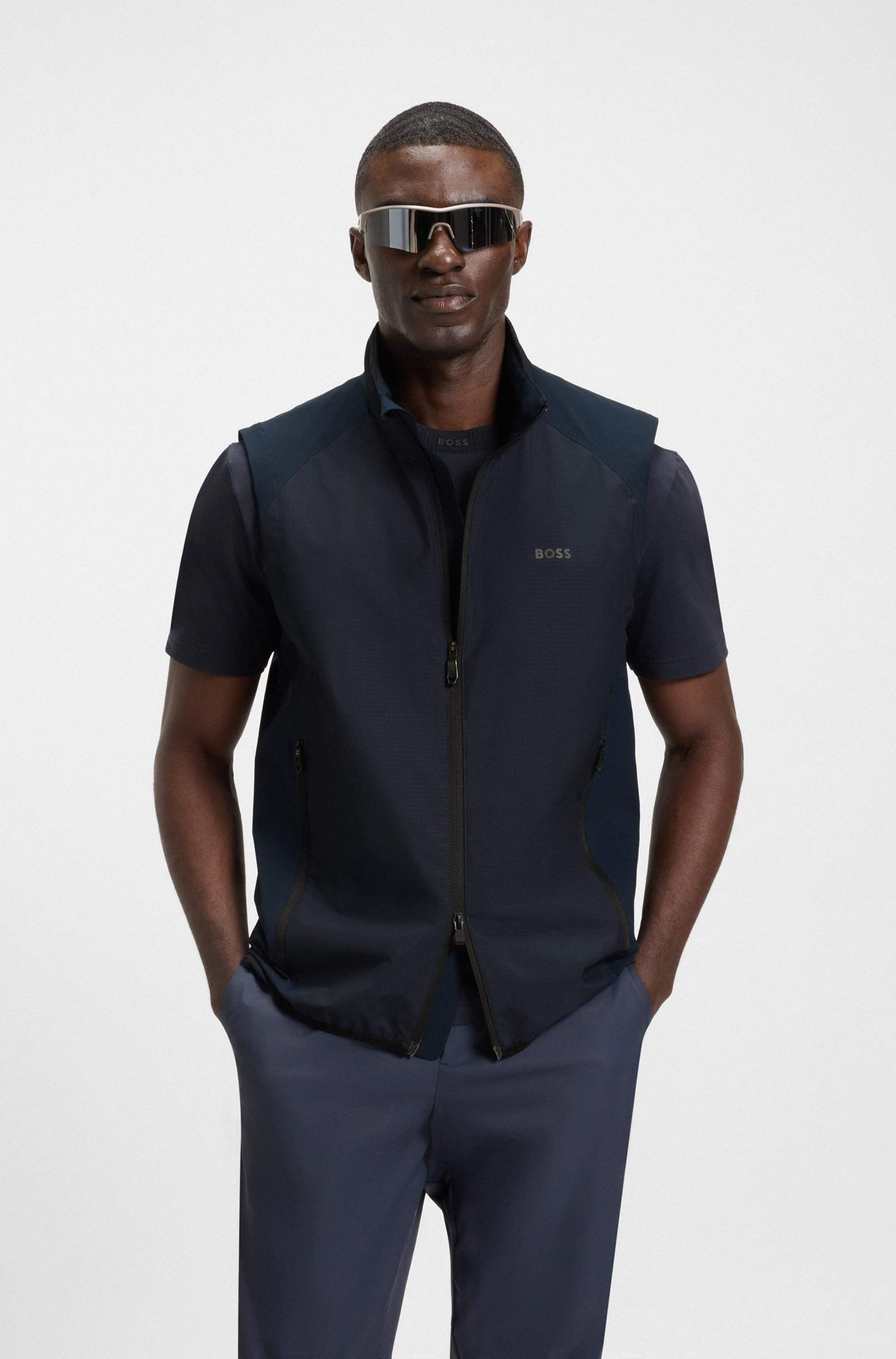 Water-repellent golf vest with decorative reflective details