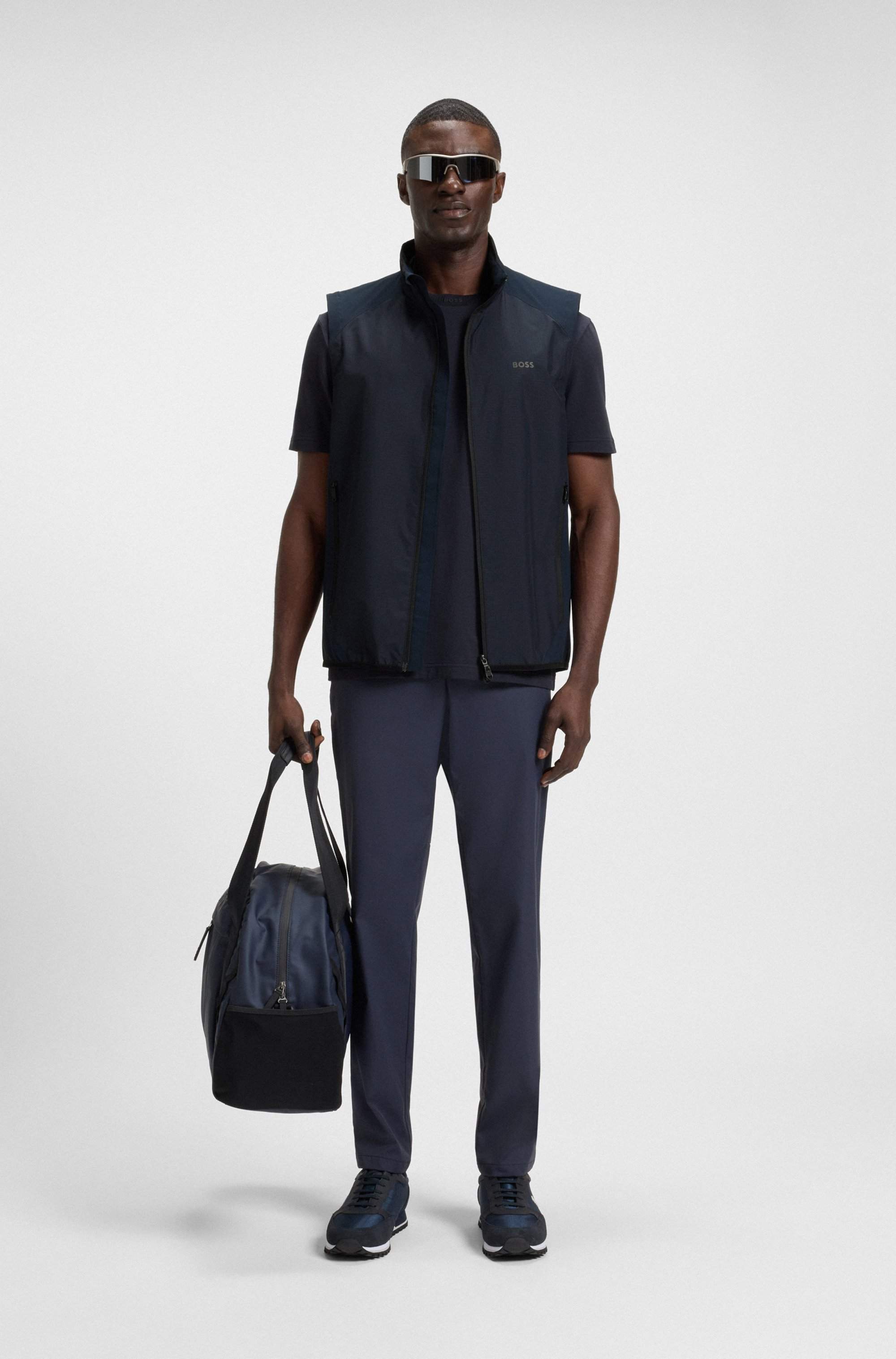 Water-repellent golf vest with decorative reflective details