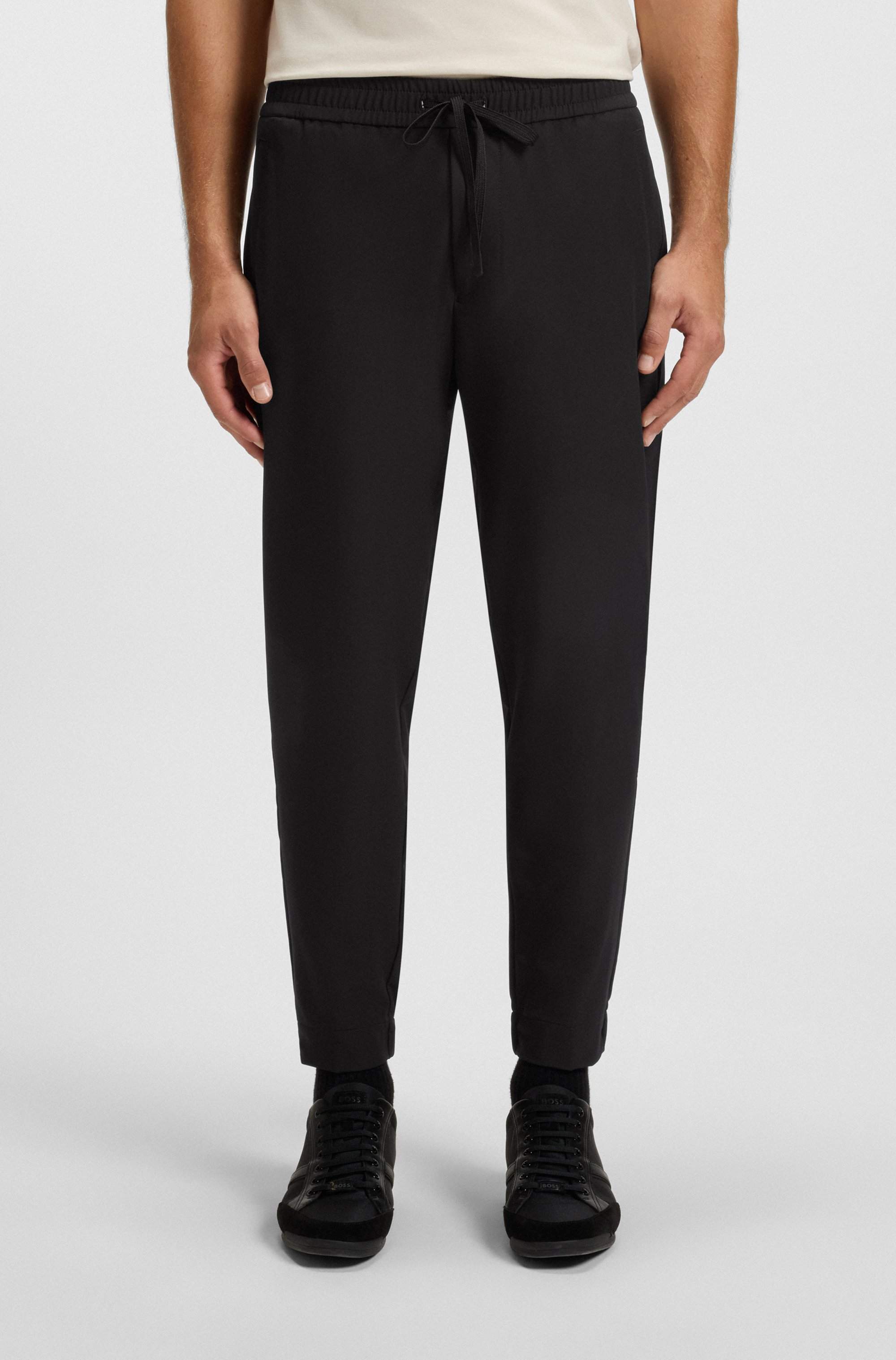 Tapered-fit trousers in water-repellent stretch fabric