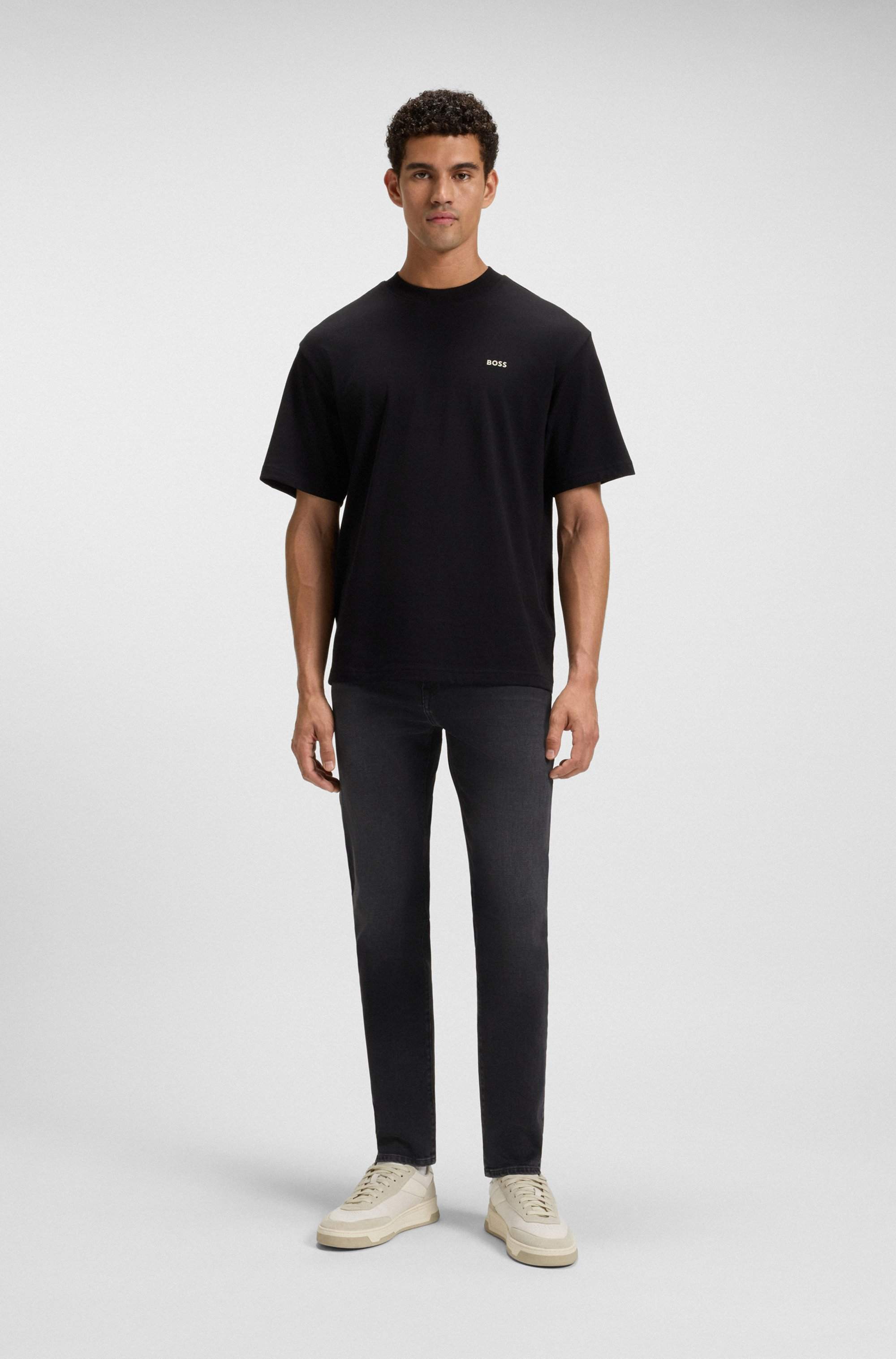 Tapered-fit jeans in black comfort-stretch denim