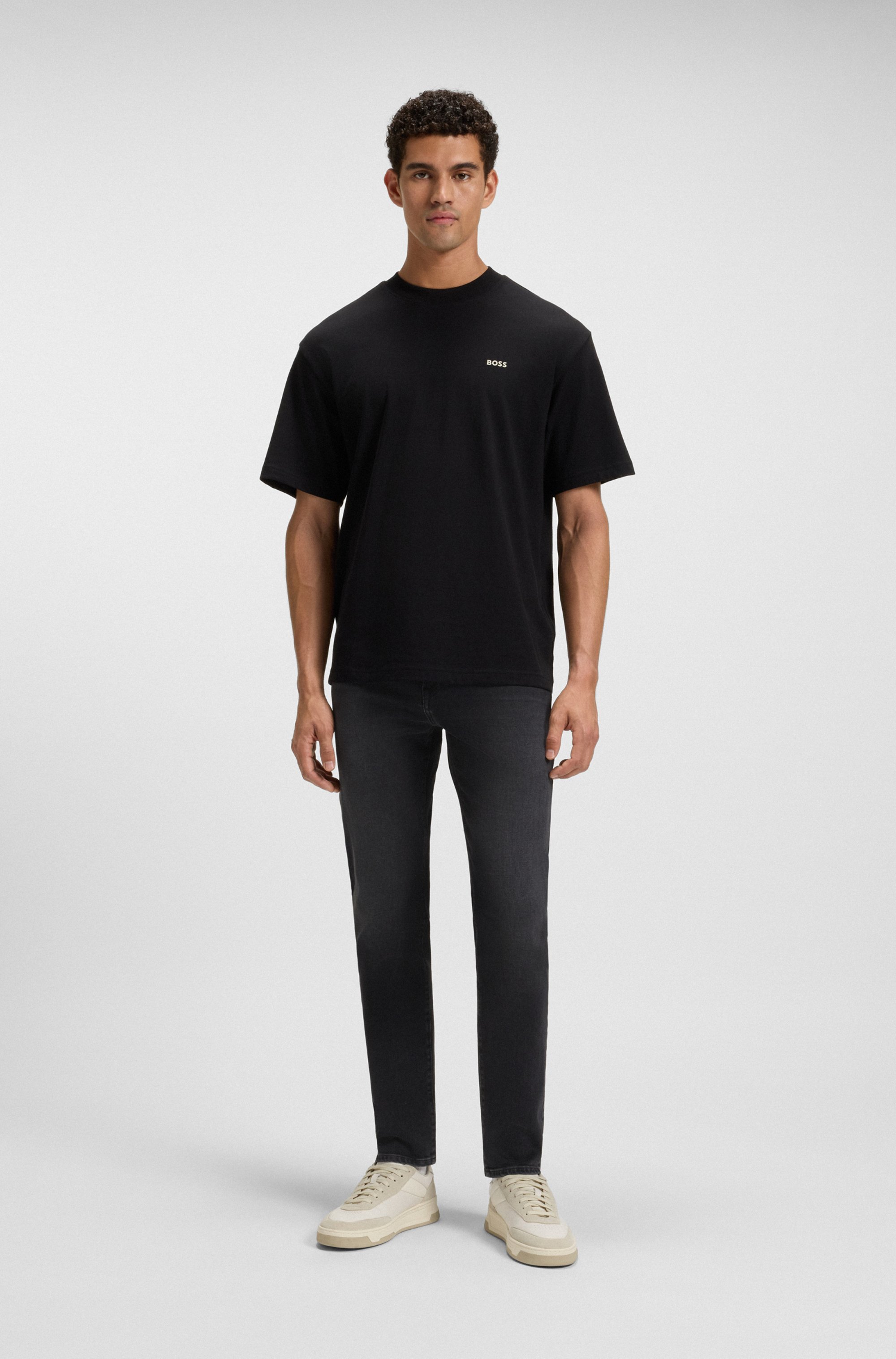 Tapered-fit jeans in black comfort-stretch denim