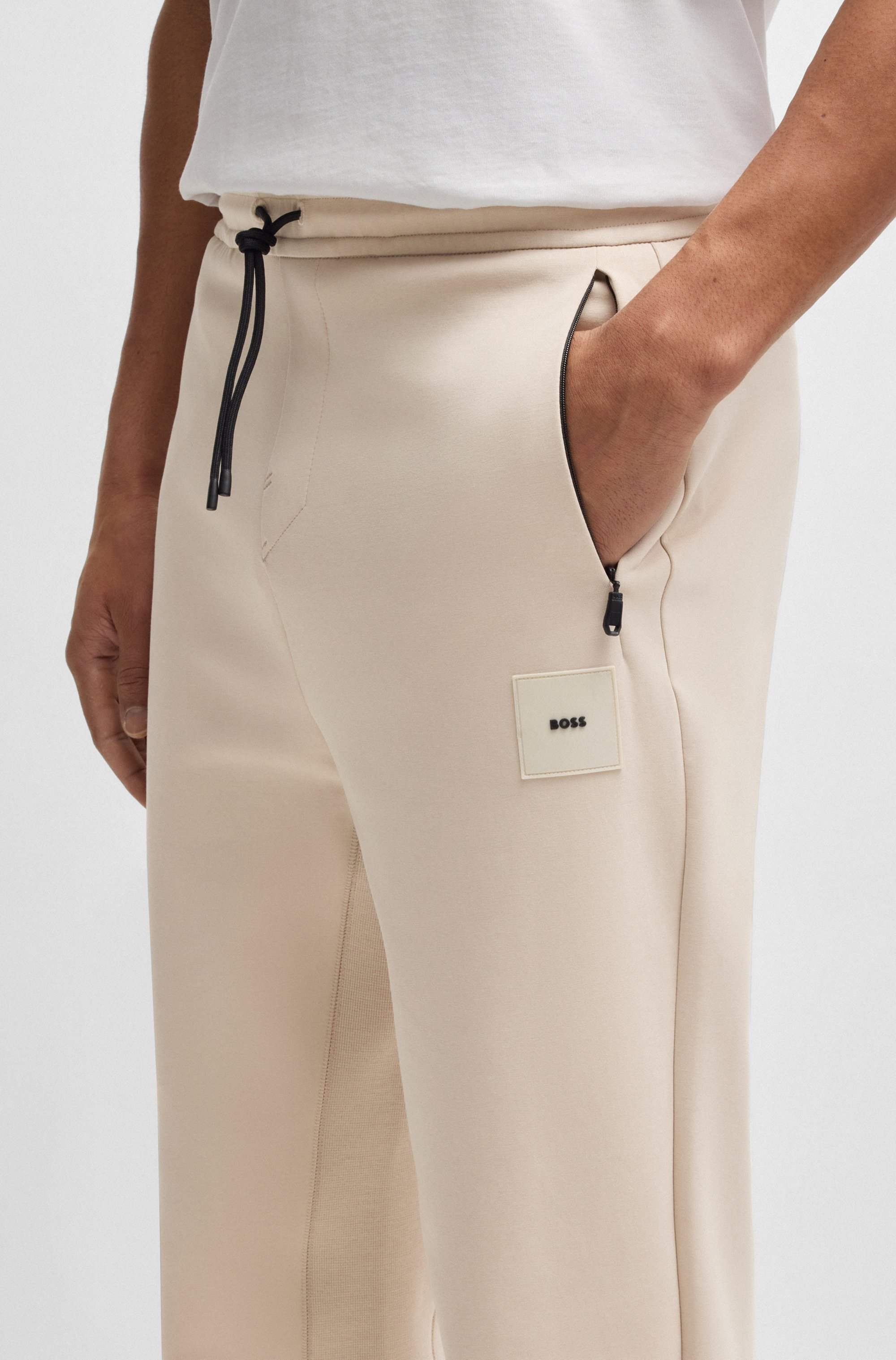 Cotton-blend tracksuit bottoms with stretch