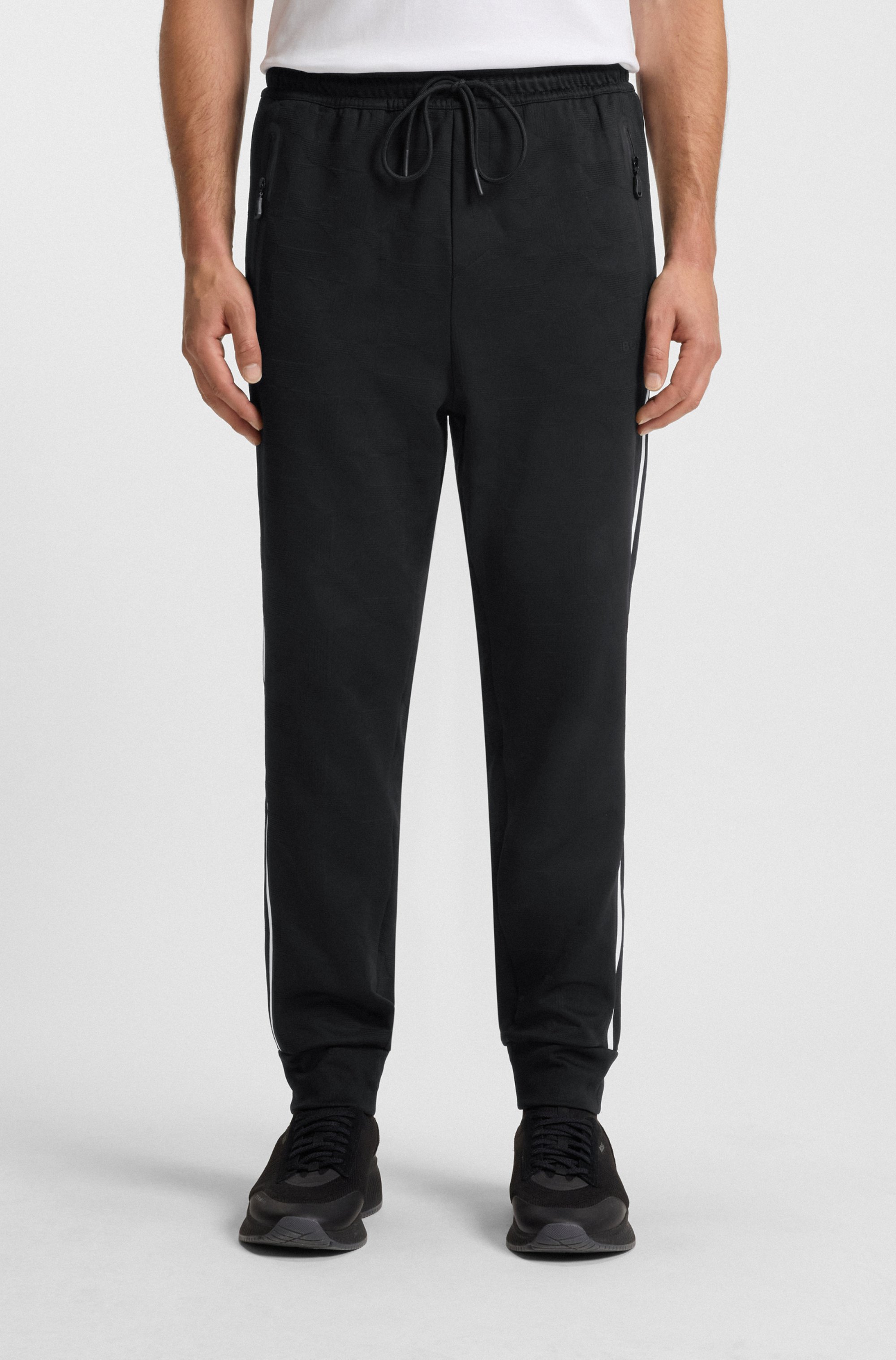 Relaxed-fit tracksuit bottoms with jacquard-woven circles