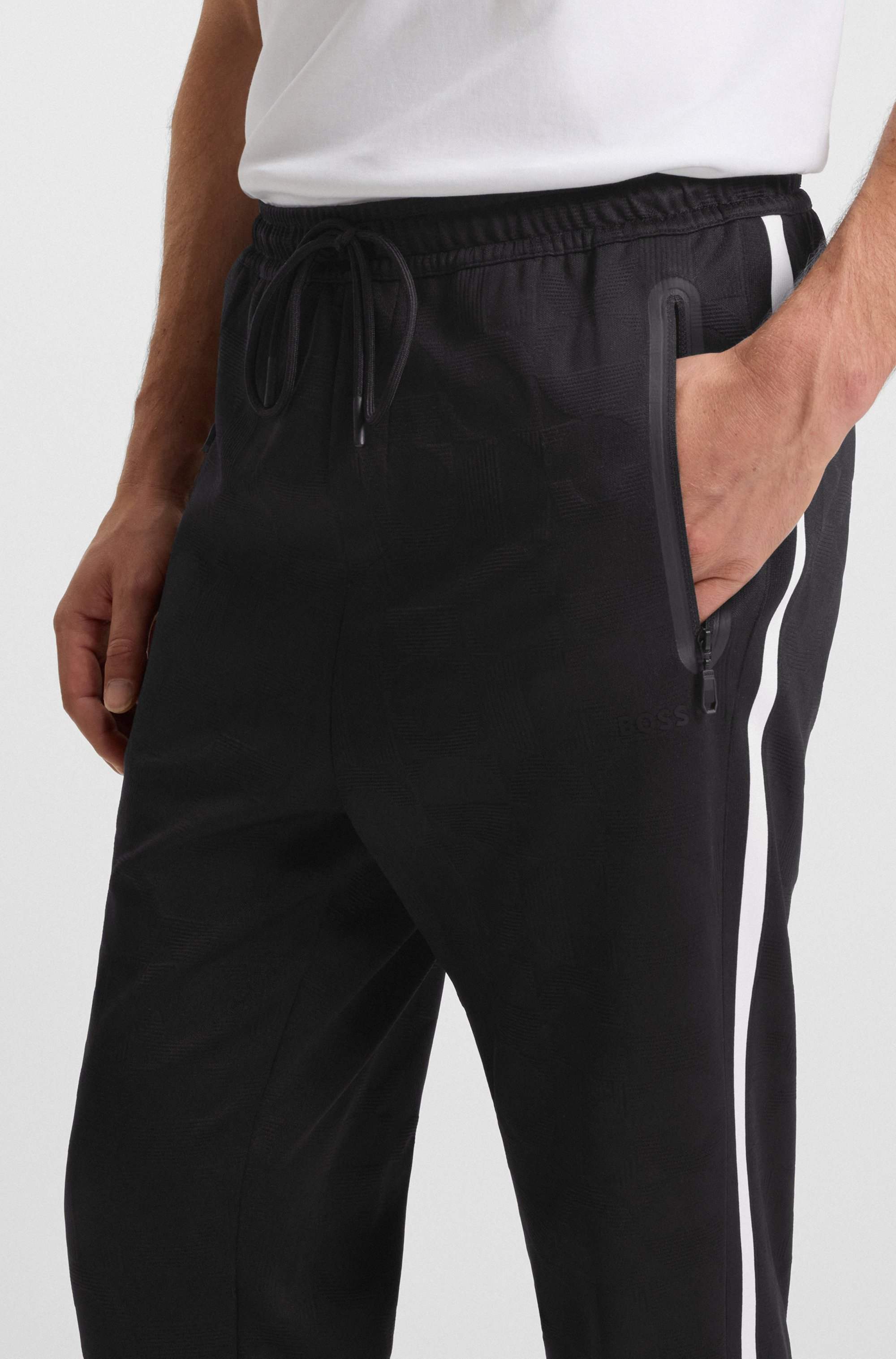 Relaxed-fit tracksuit bottoms with jacquard-woven circles