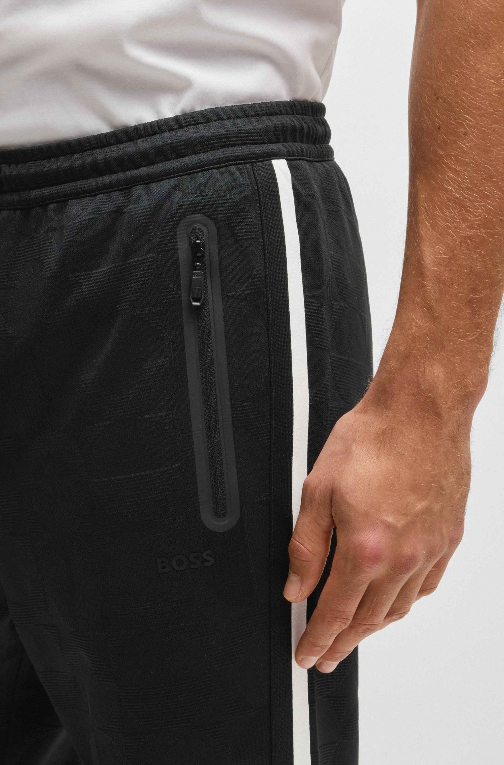 Relaxed-fit tracksuit bottoms with jacquard-woven circles