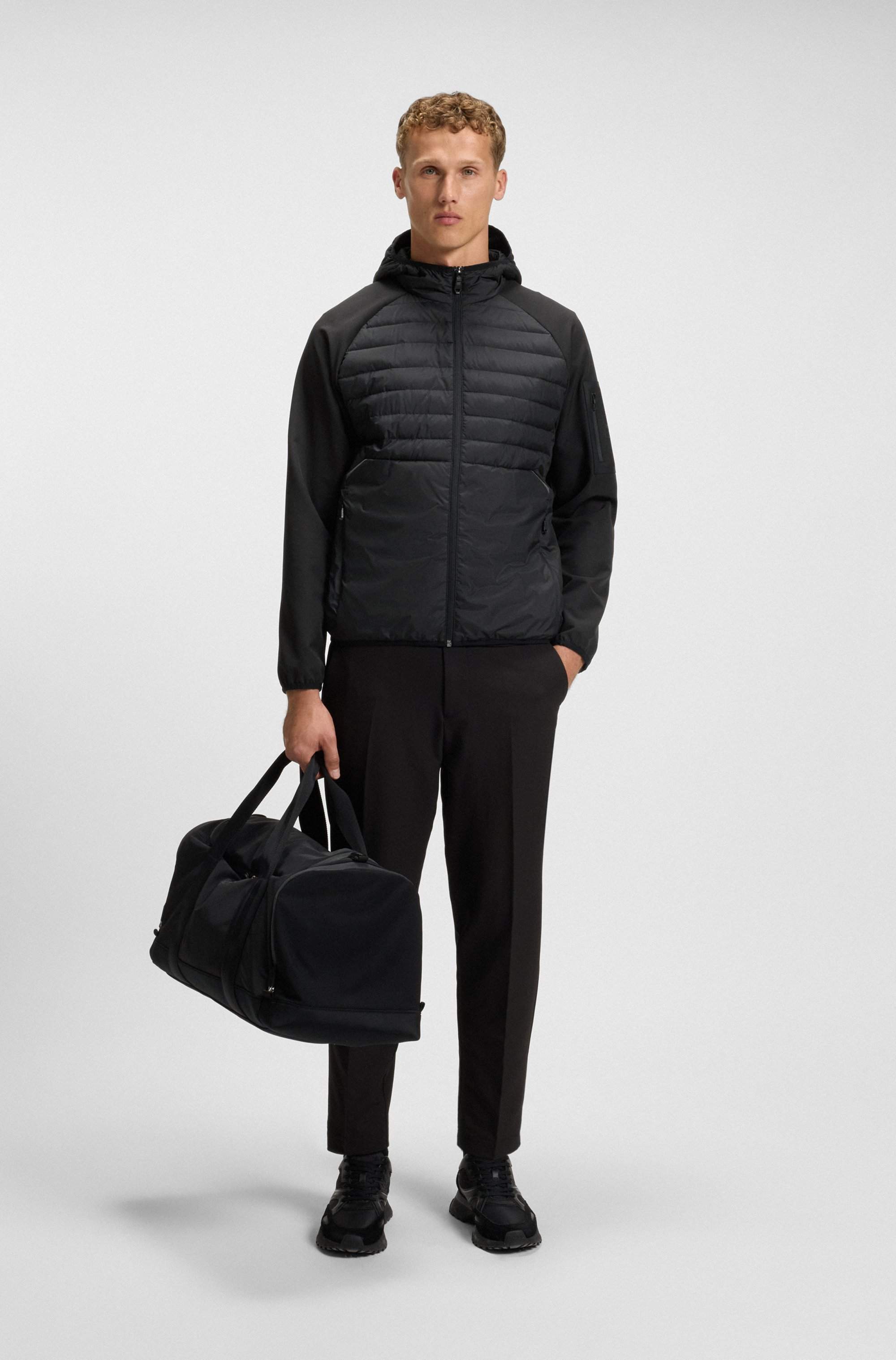 Water-repellent jacket with zipped sleeve pocket