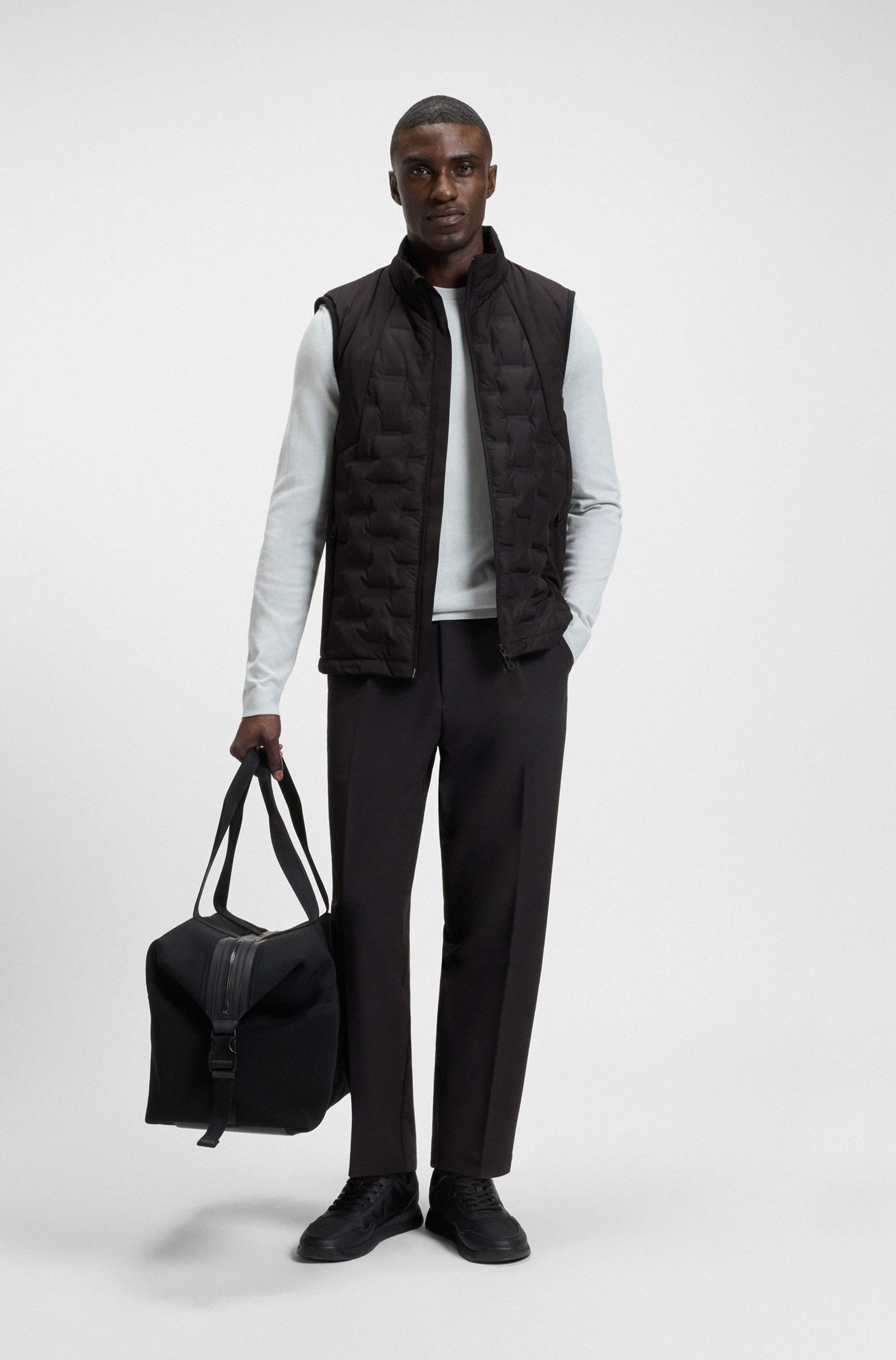 Down-filled gilet with welded-logo pattern