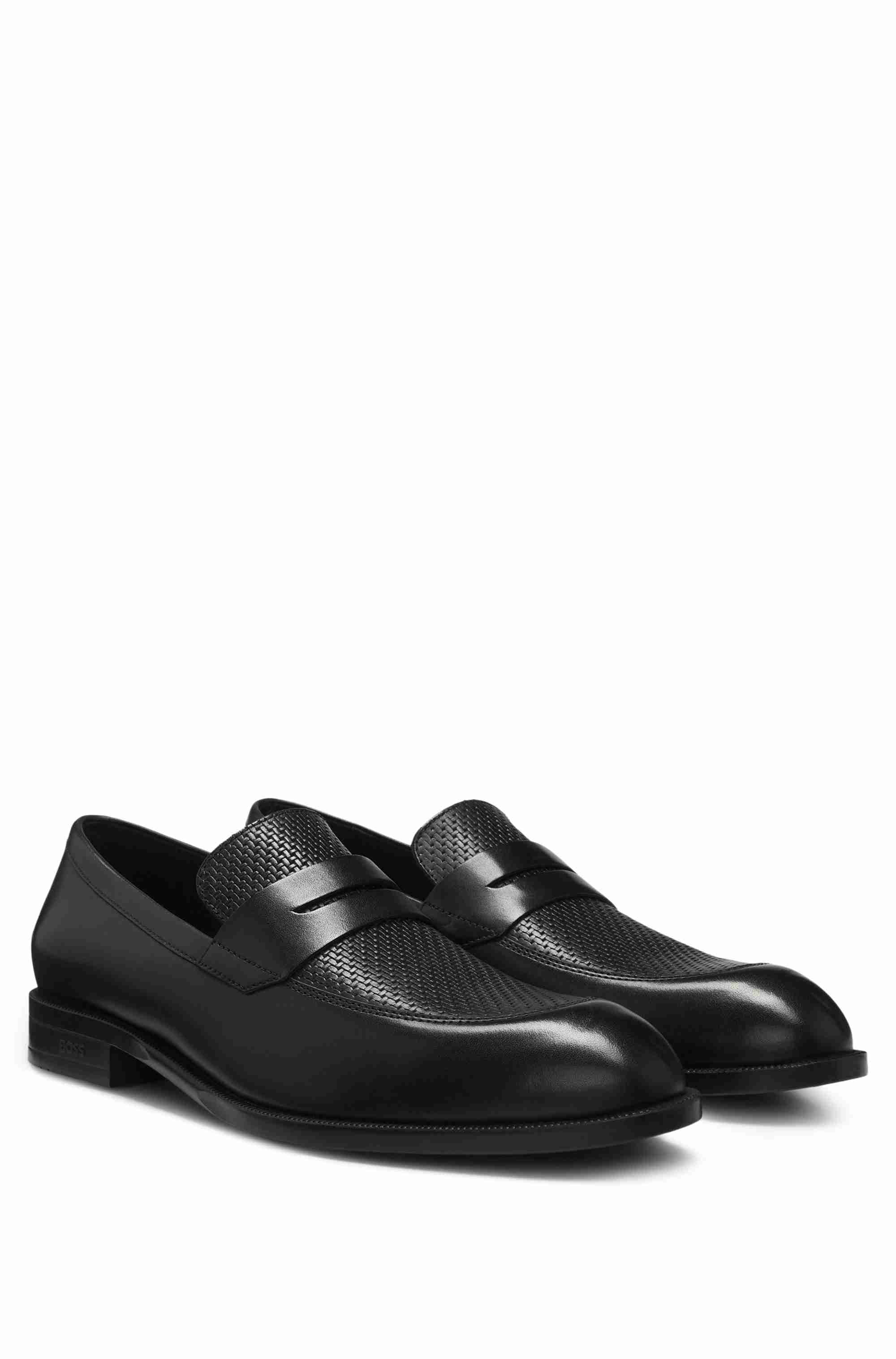 Penny loafers in printed and smooth leather