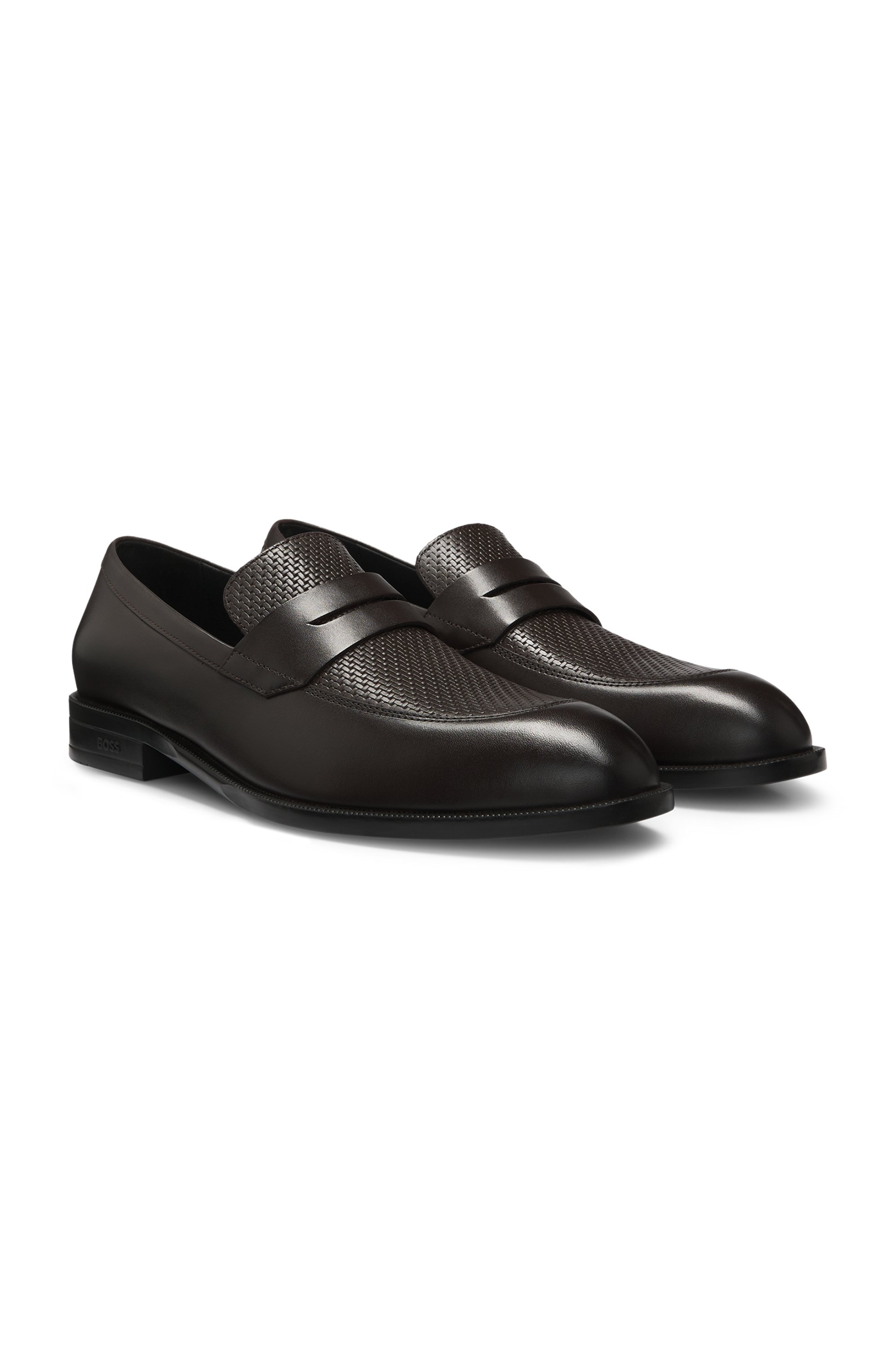Penny loafers in printed and smooth leather