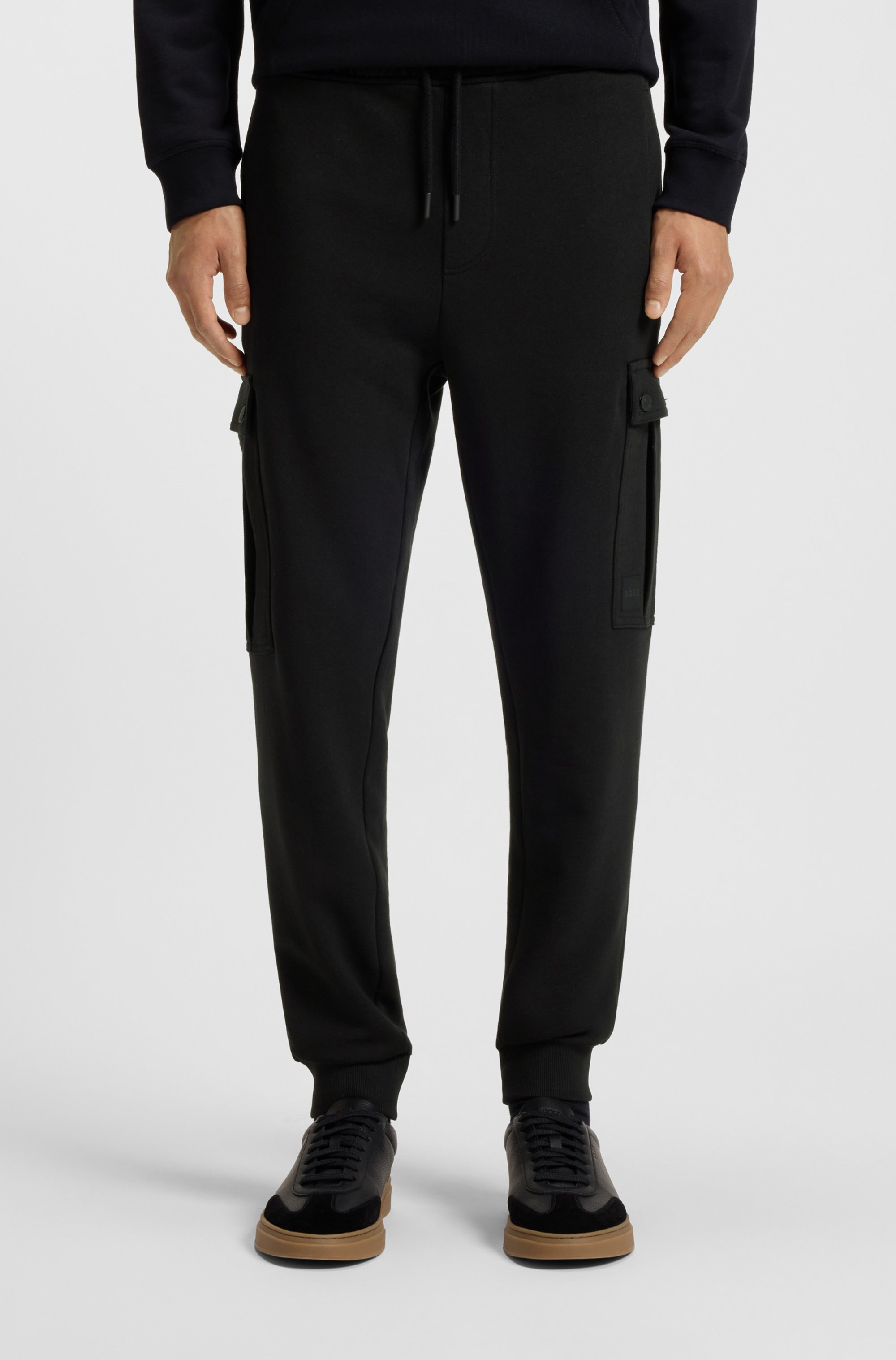 Relaxed-fit cotton-terry tracksuit bottoms with cargo pockets