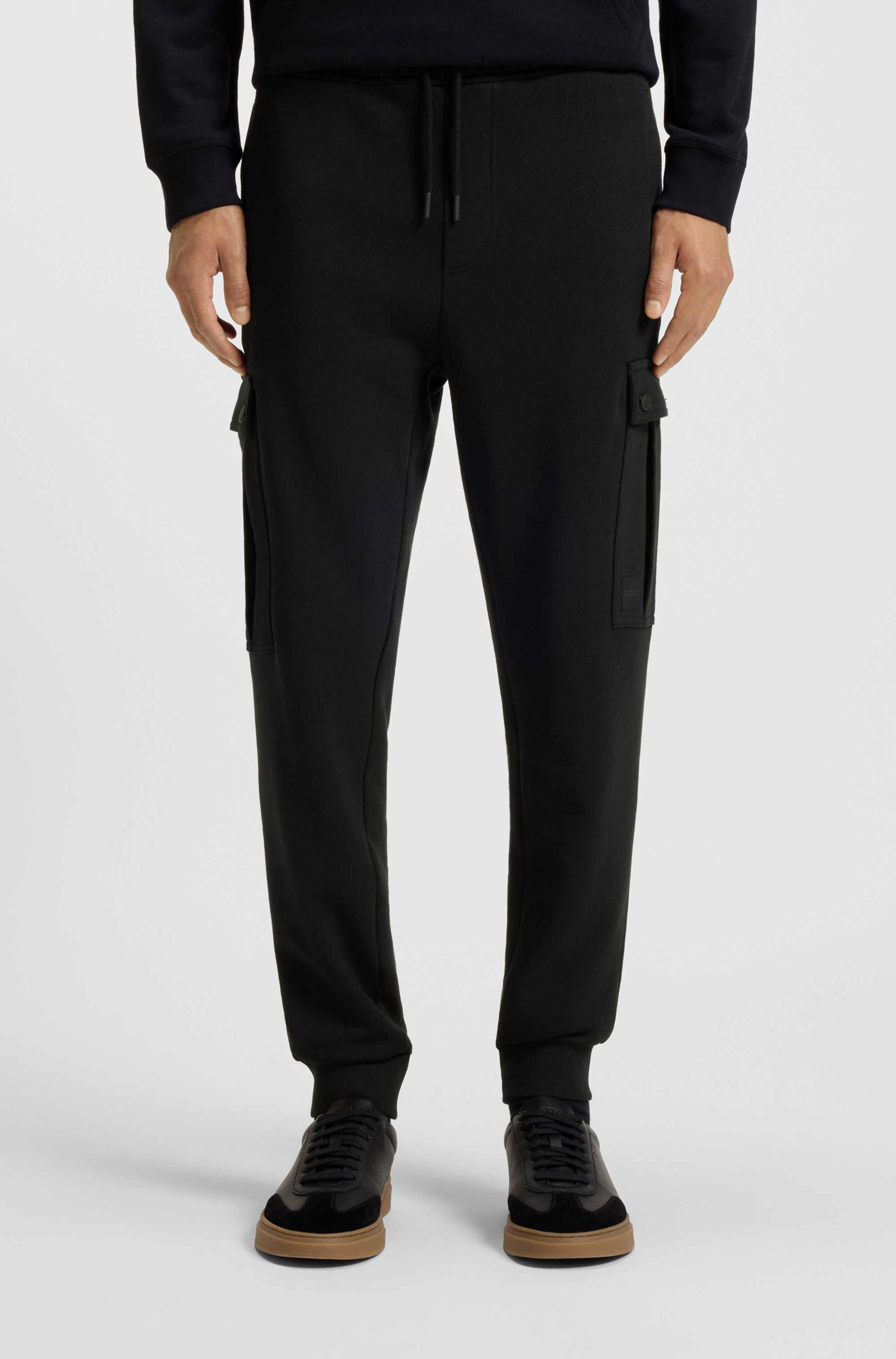 Relaxed-fit cotton-terry tracksuit bottoms with cargo pockets