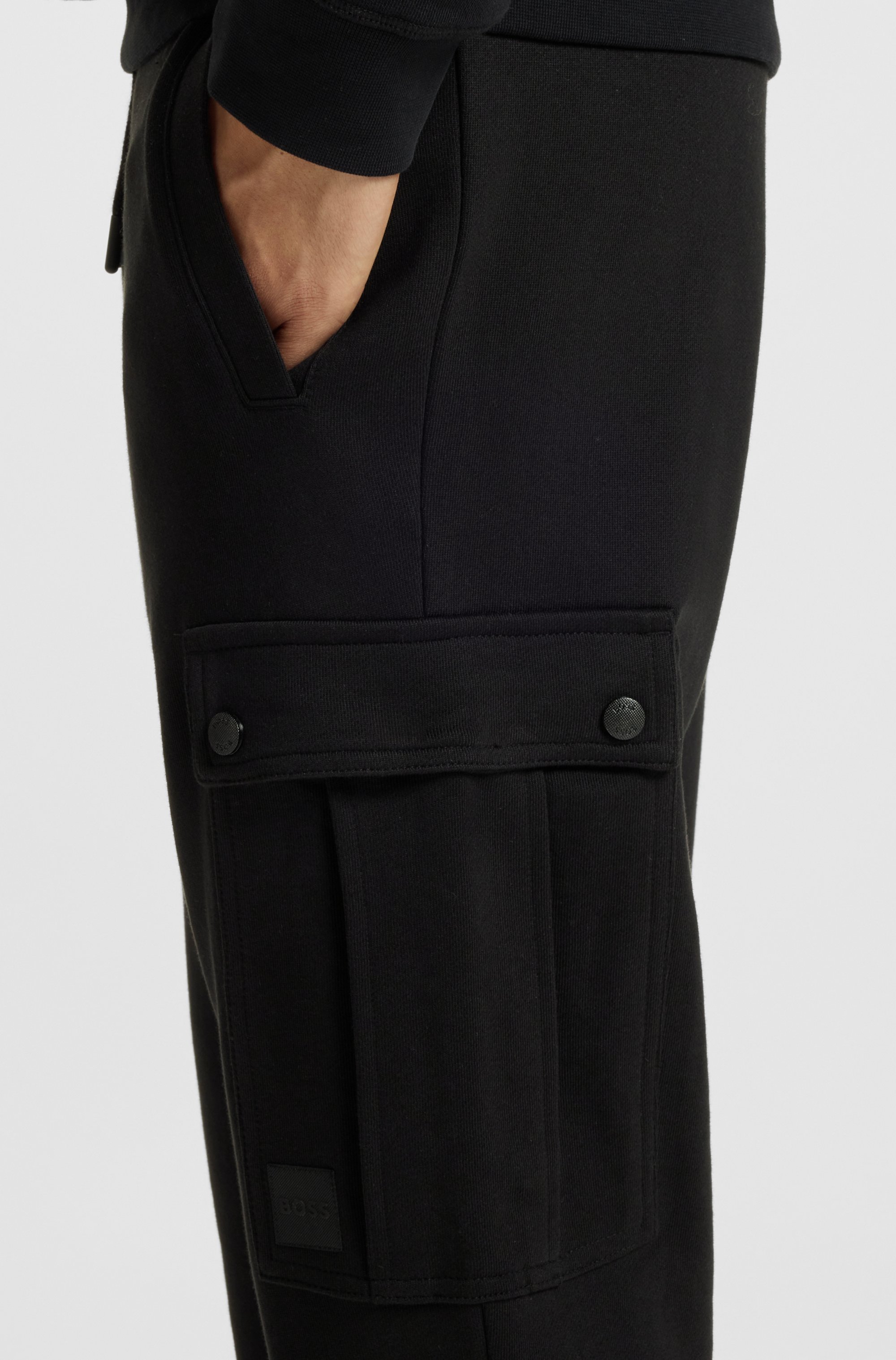 Relaxed-fit cotton-terry tracksuit bottoms with cargo pockets