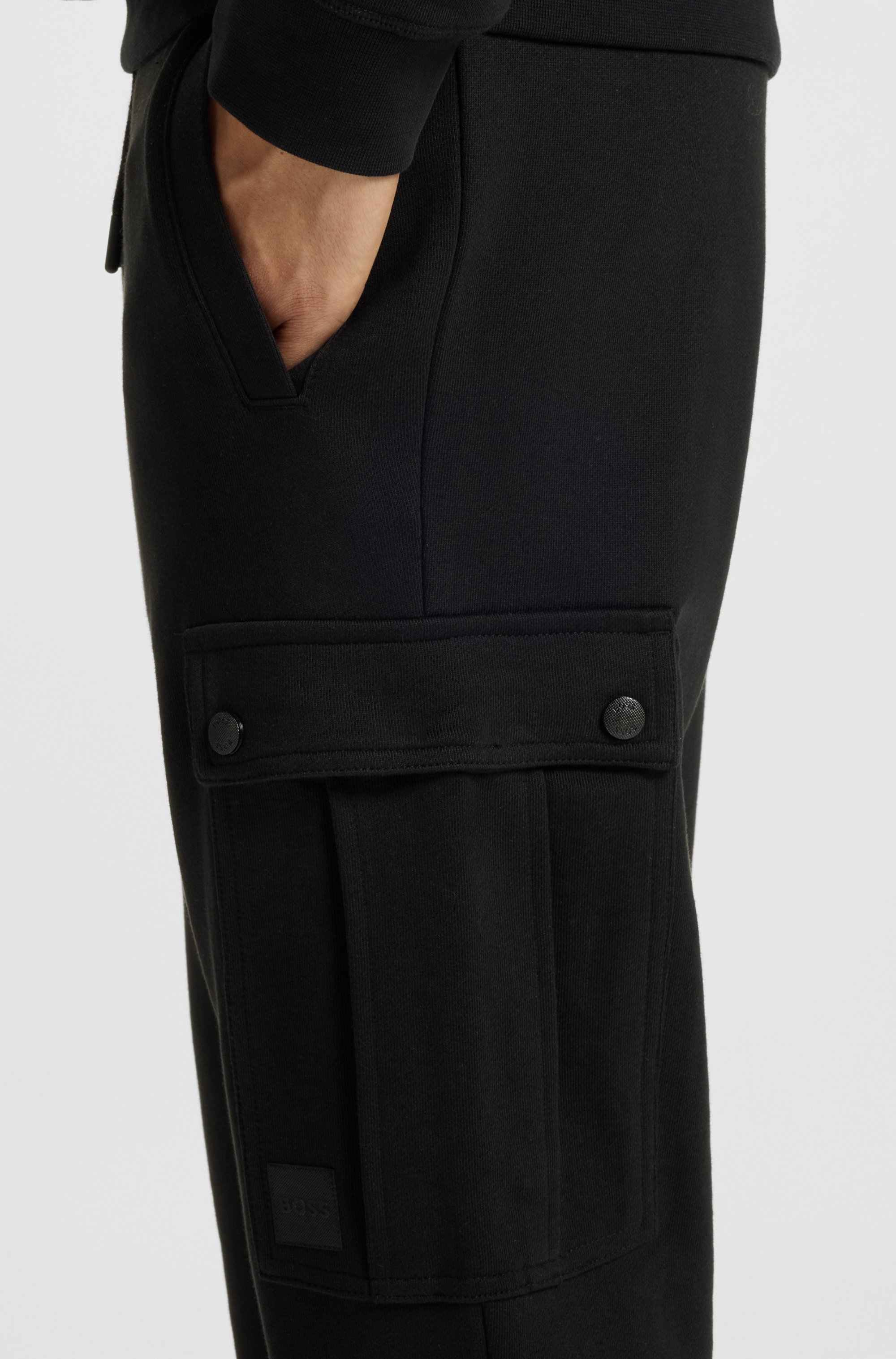 Relaxed-fit cotton-terry tracksuit bottoms with cargo pockets