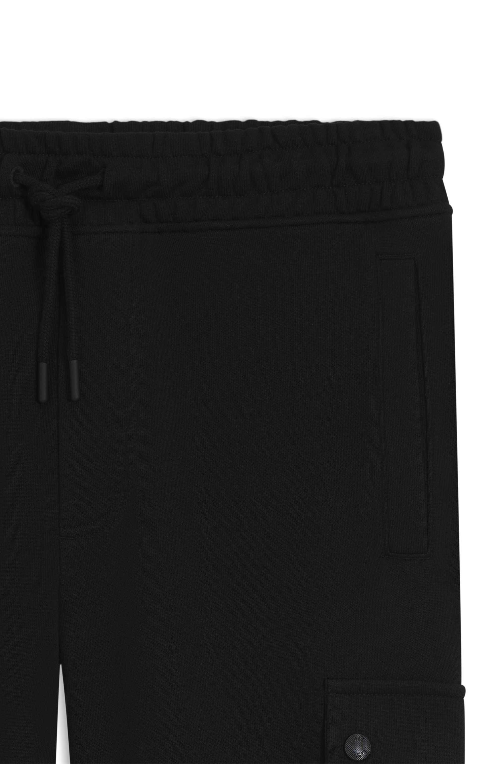 Relaxed-fit cotton-terry tracksuit bottoms with cargo pockets