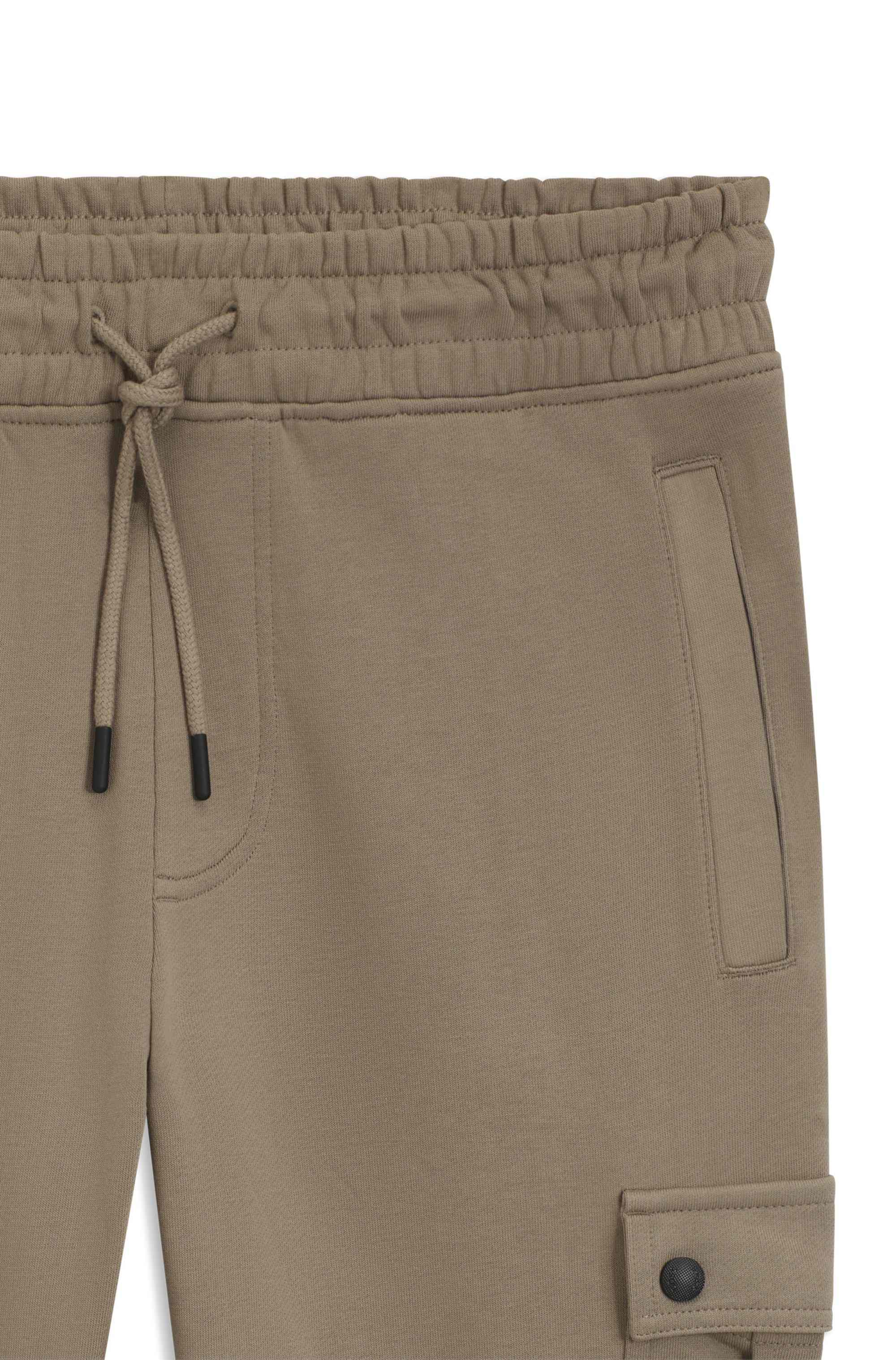 Relaxed-fit cotton-terry tracksuit bottoms with cargo pockets