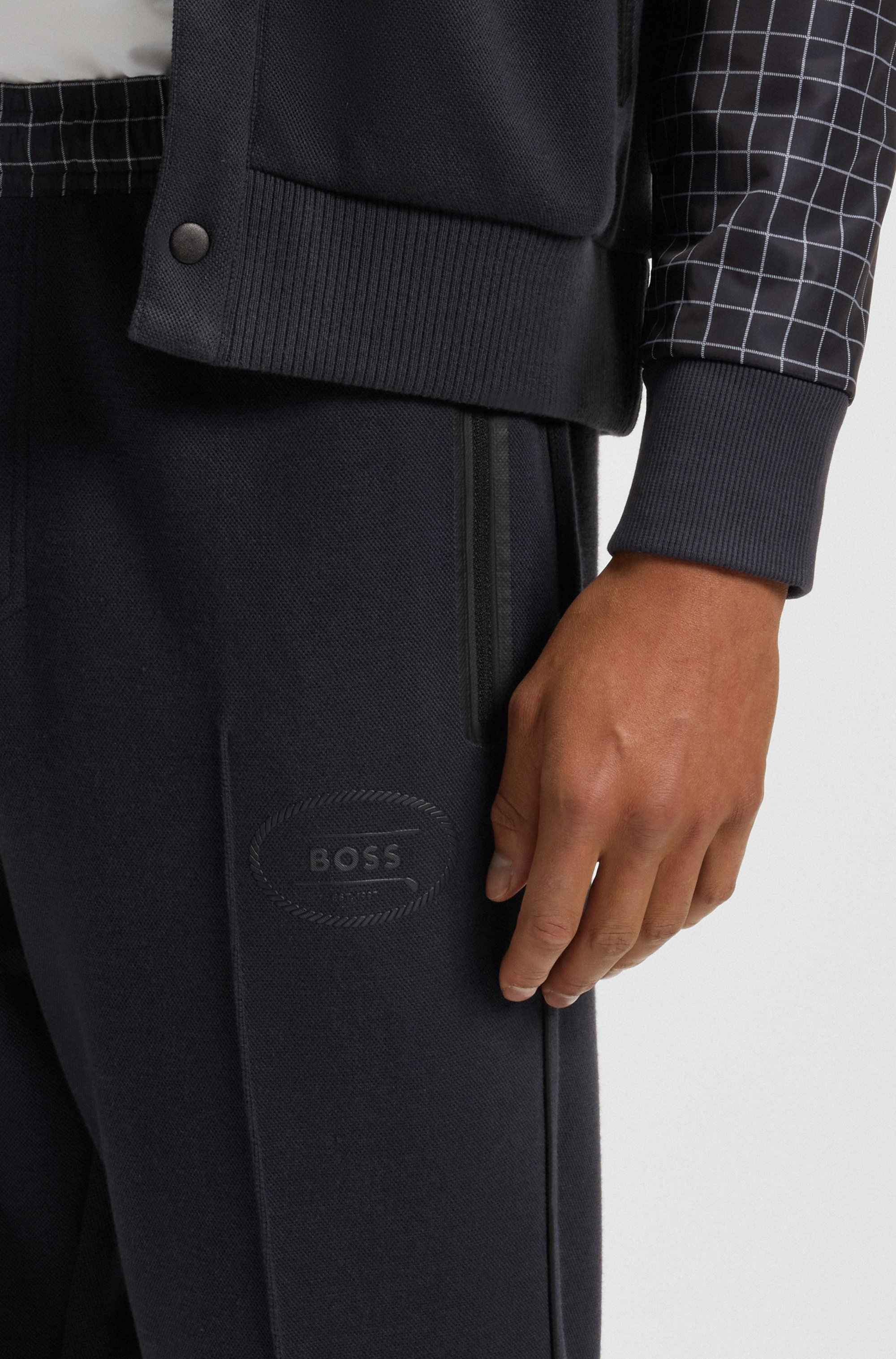 Check-print tracksuit bottoms in stretch piqué