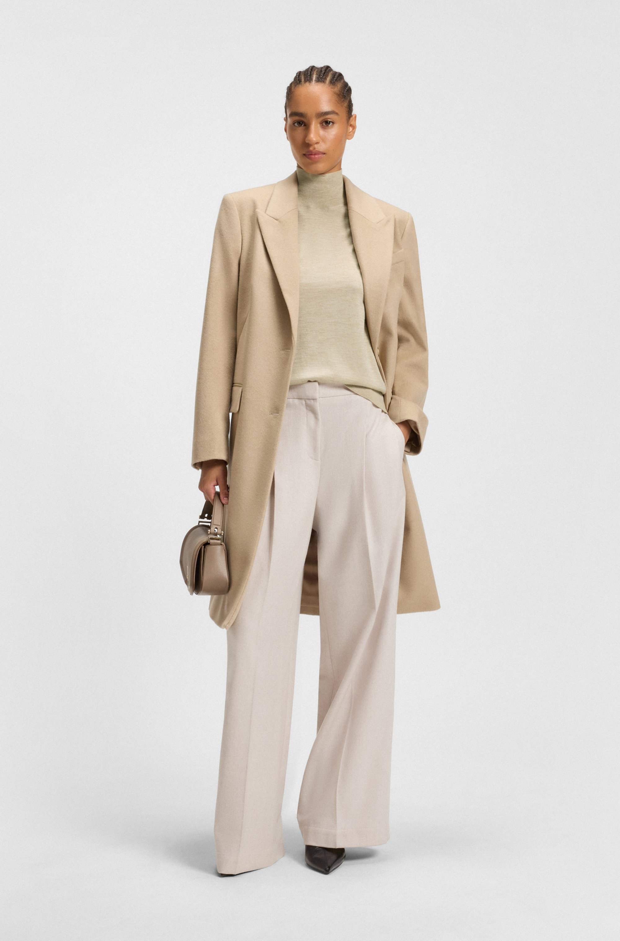 Sleeveless top in merino wool with mock neckline