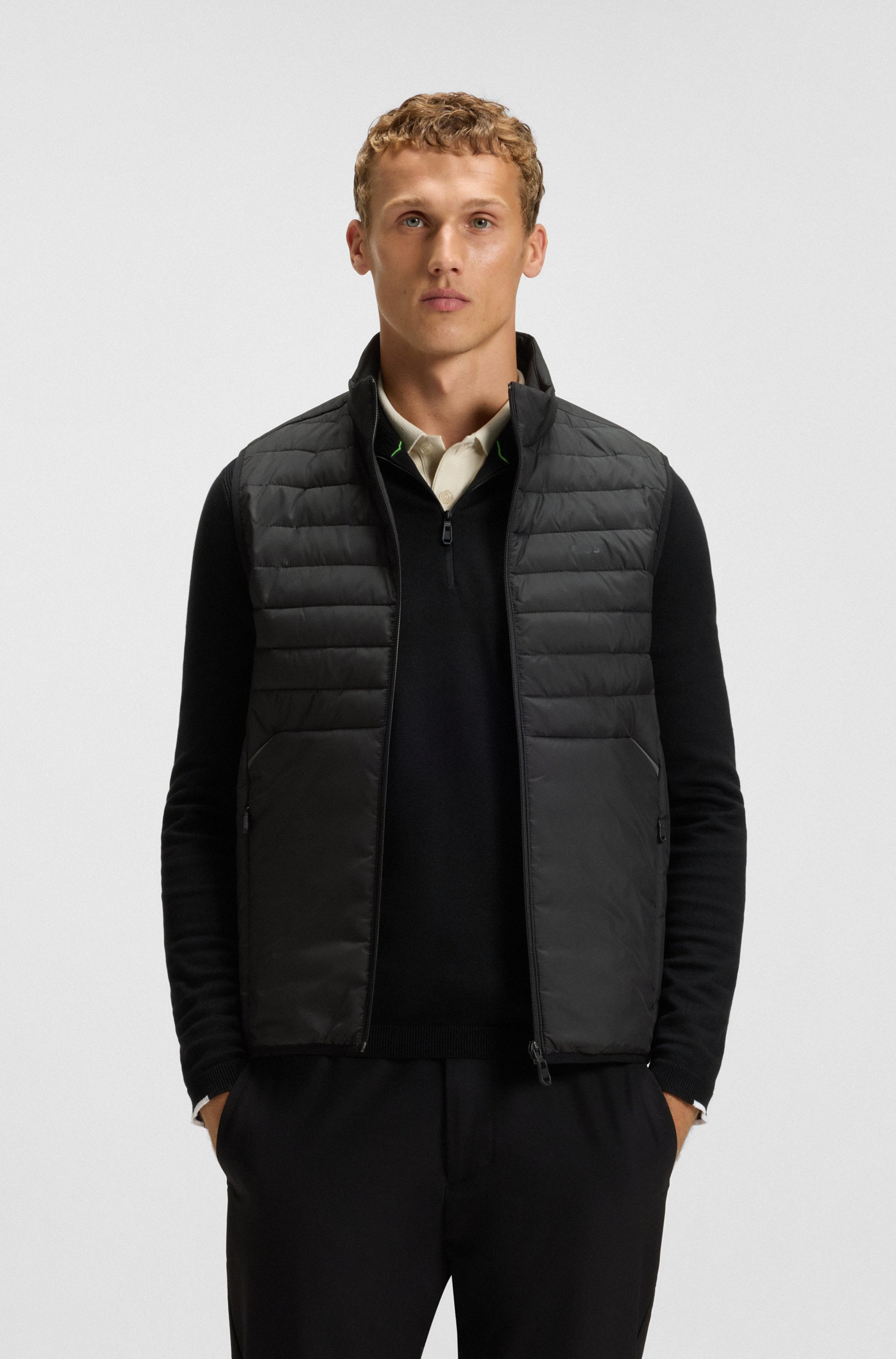 Water-repellent gilet with decorative reflective accents