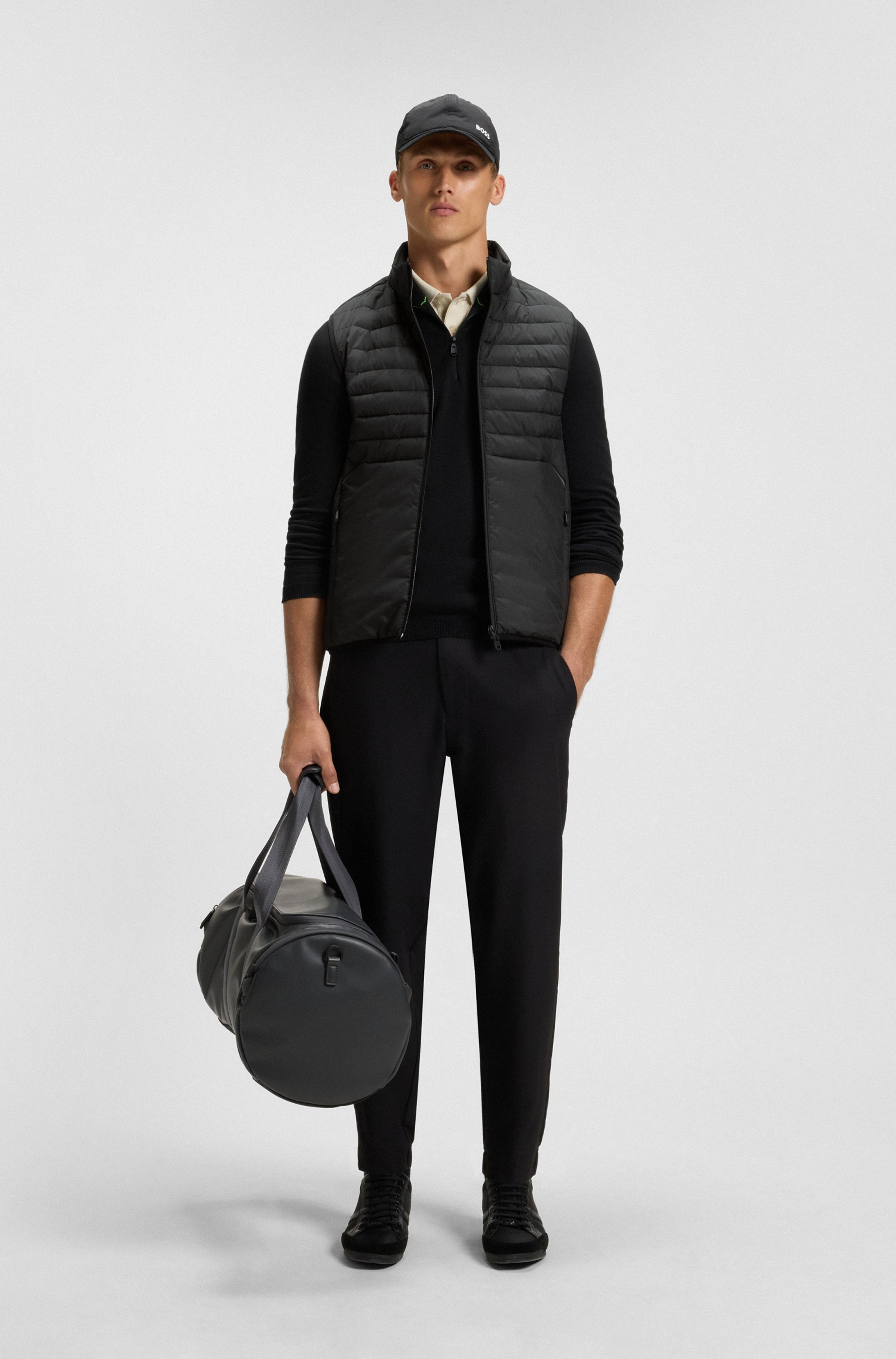 Water-repellent gilet with decorative reflective accents