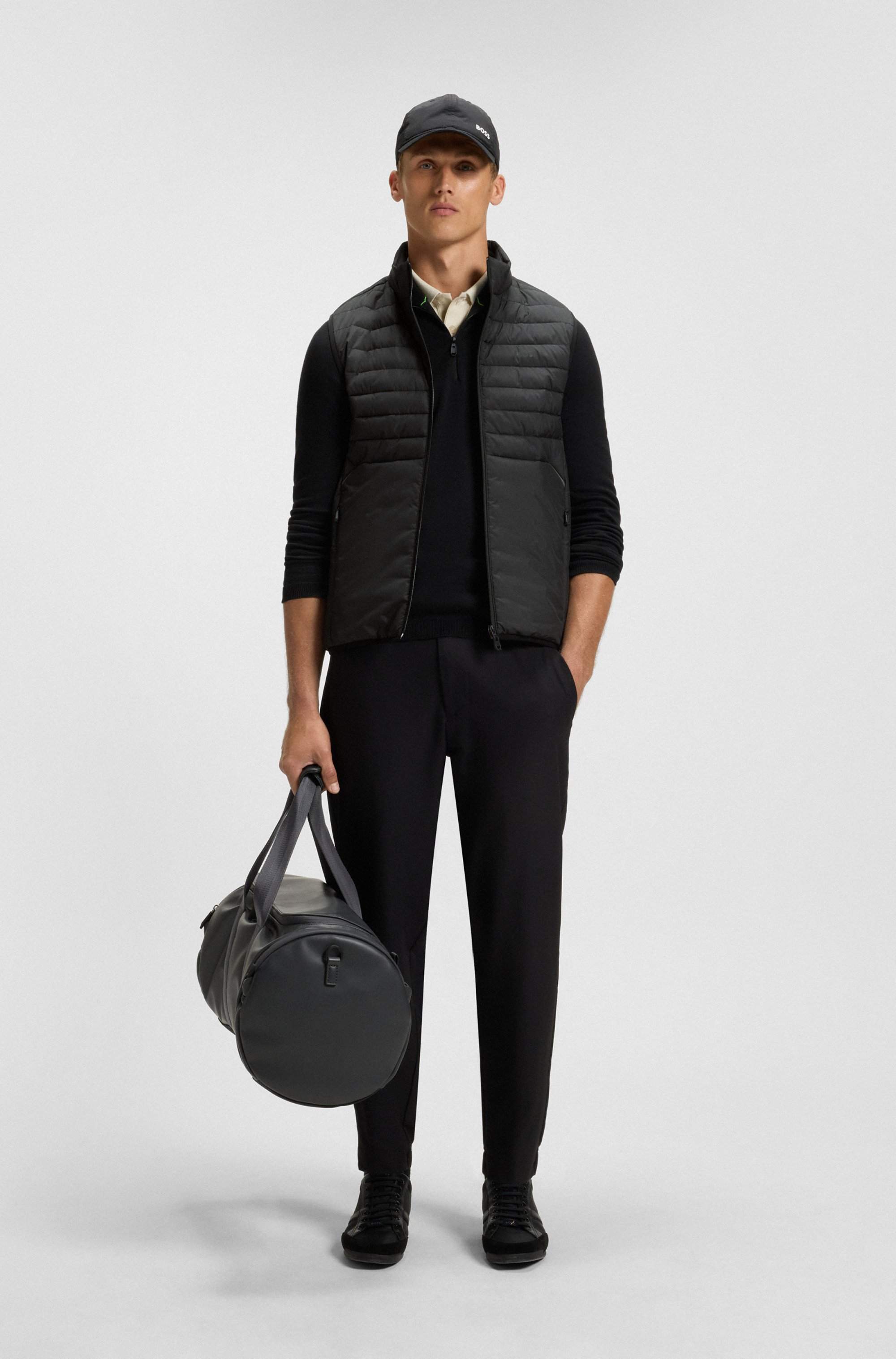 Water-repellent gilet with decorative reflective accents