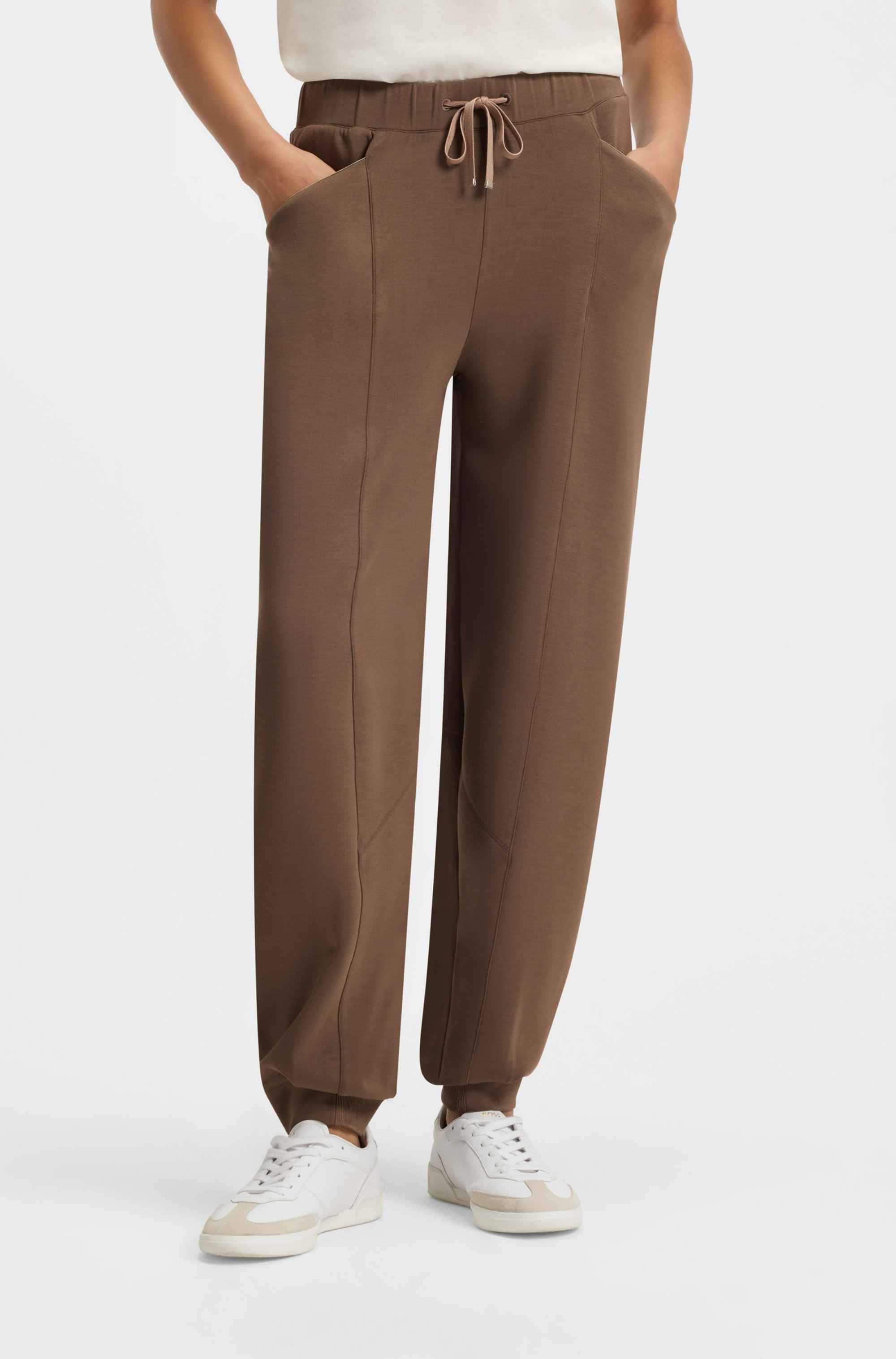 Relaxed-fit tracksuit bottoms with lustrous piping