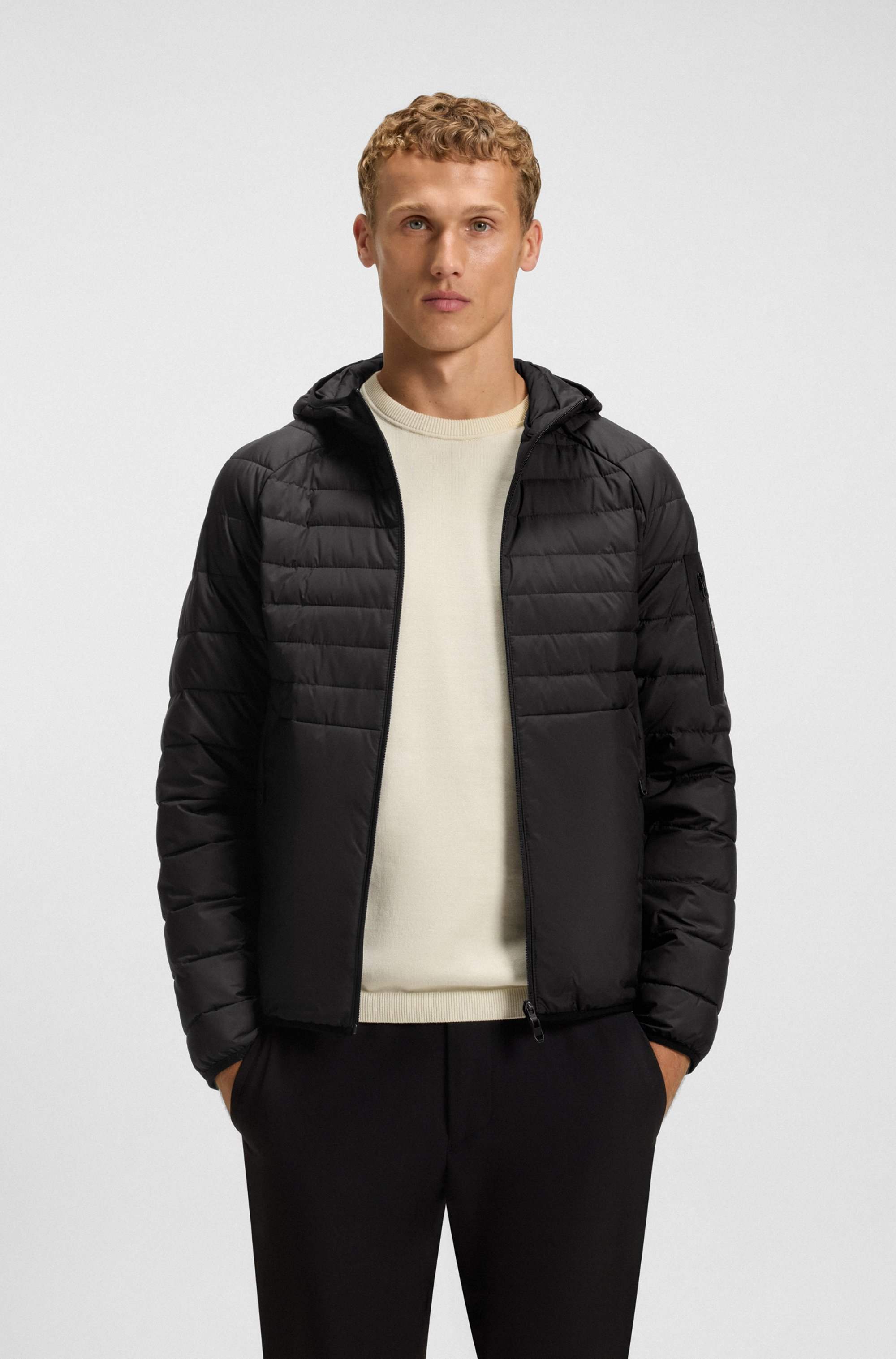 Water-repellent hooded jacket with decorative reflective details