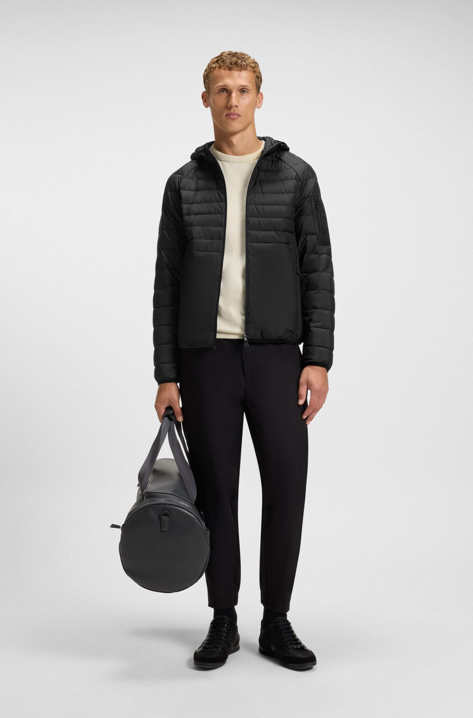 Water-repellent hooded jacket with decorative reflective details