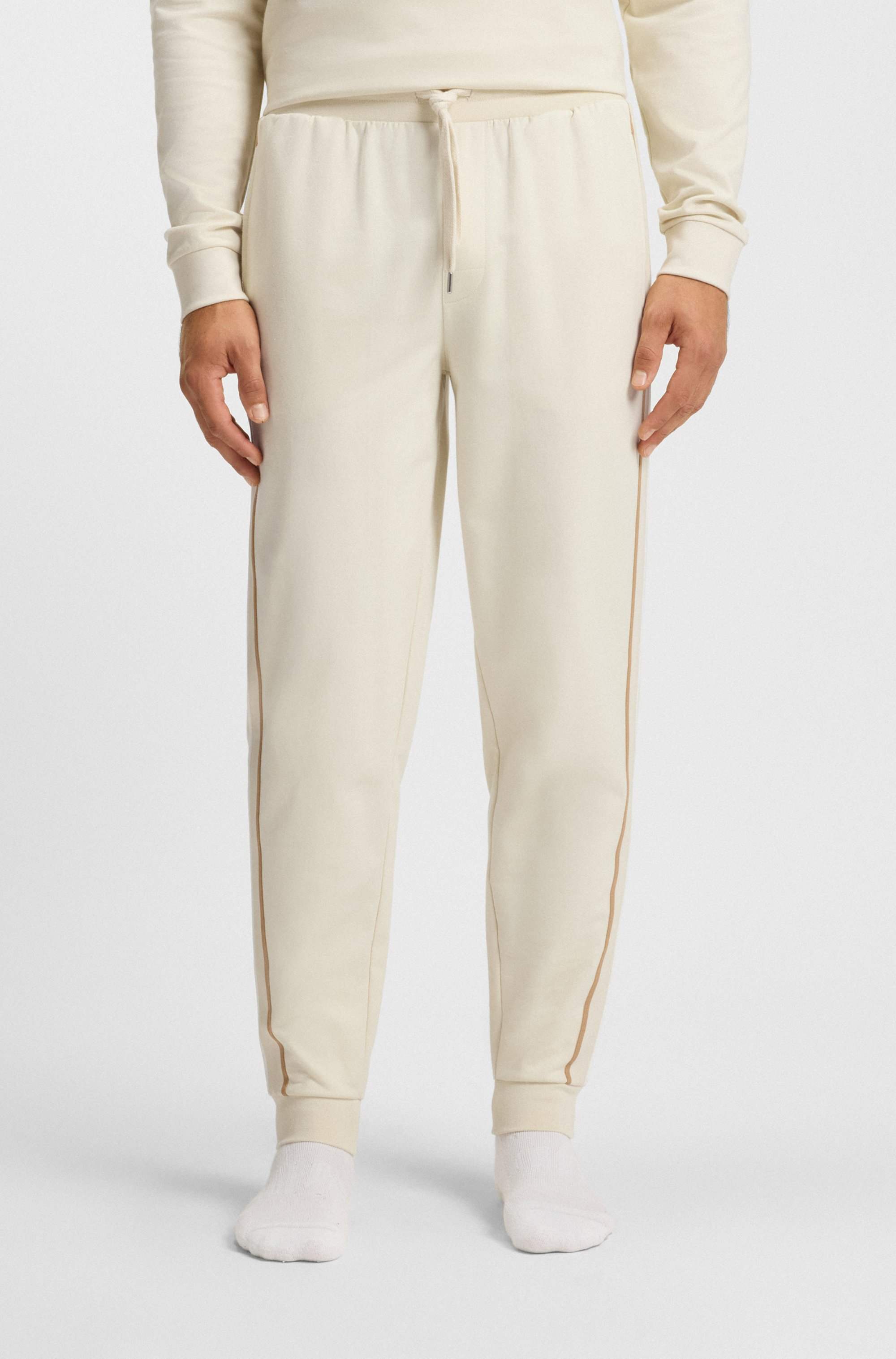 Cotton-terry tracksuit bottoms with tape and logo