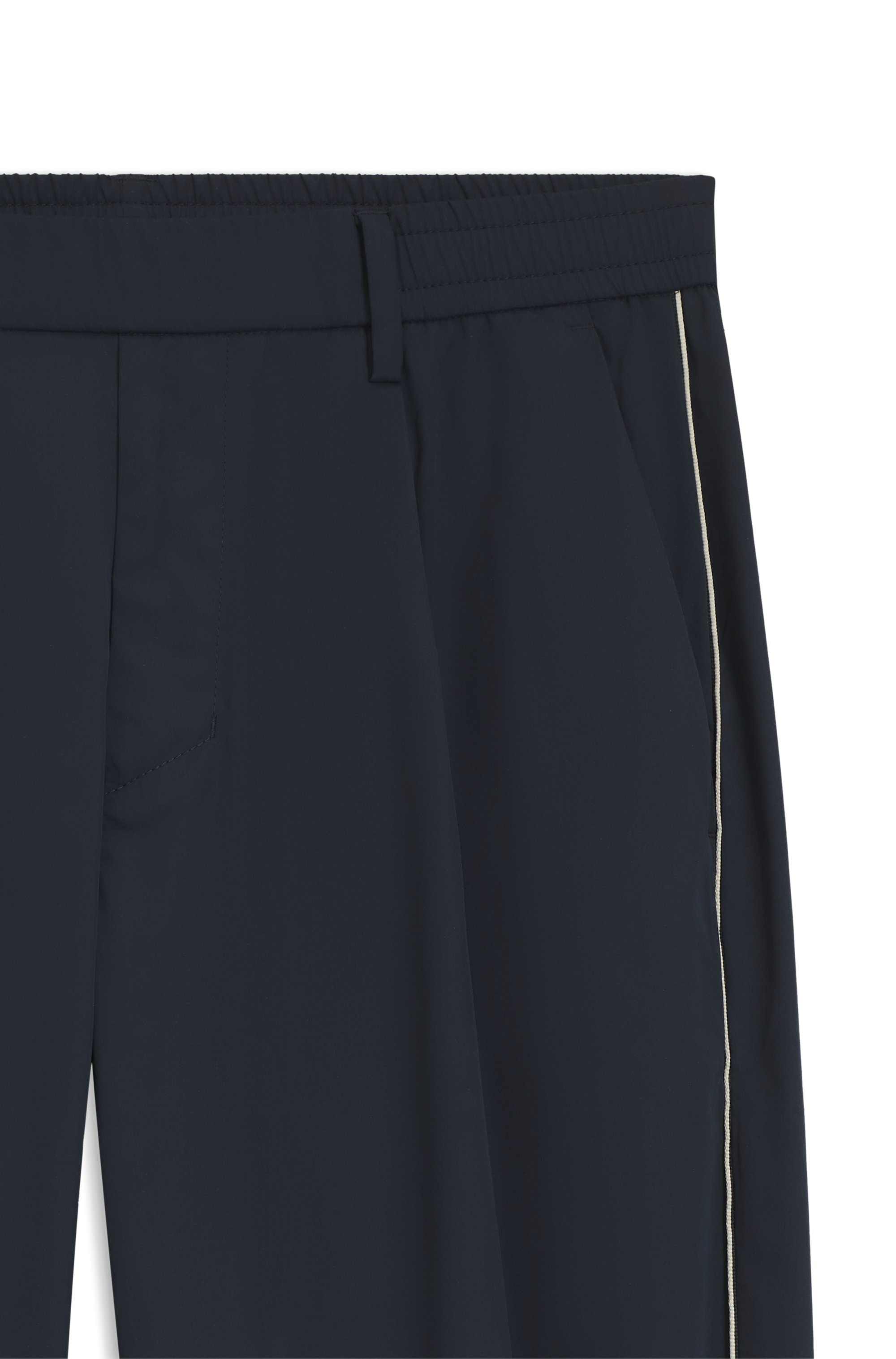 Tapered-fit trousers with water-repellent finish