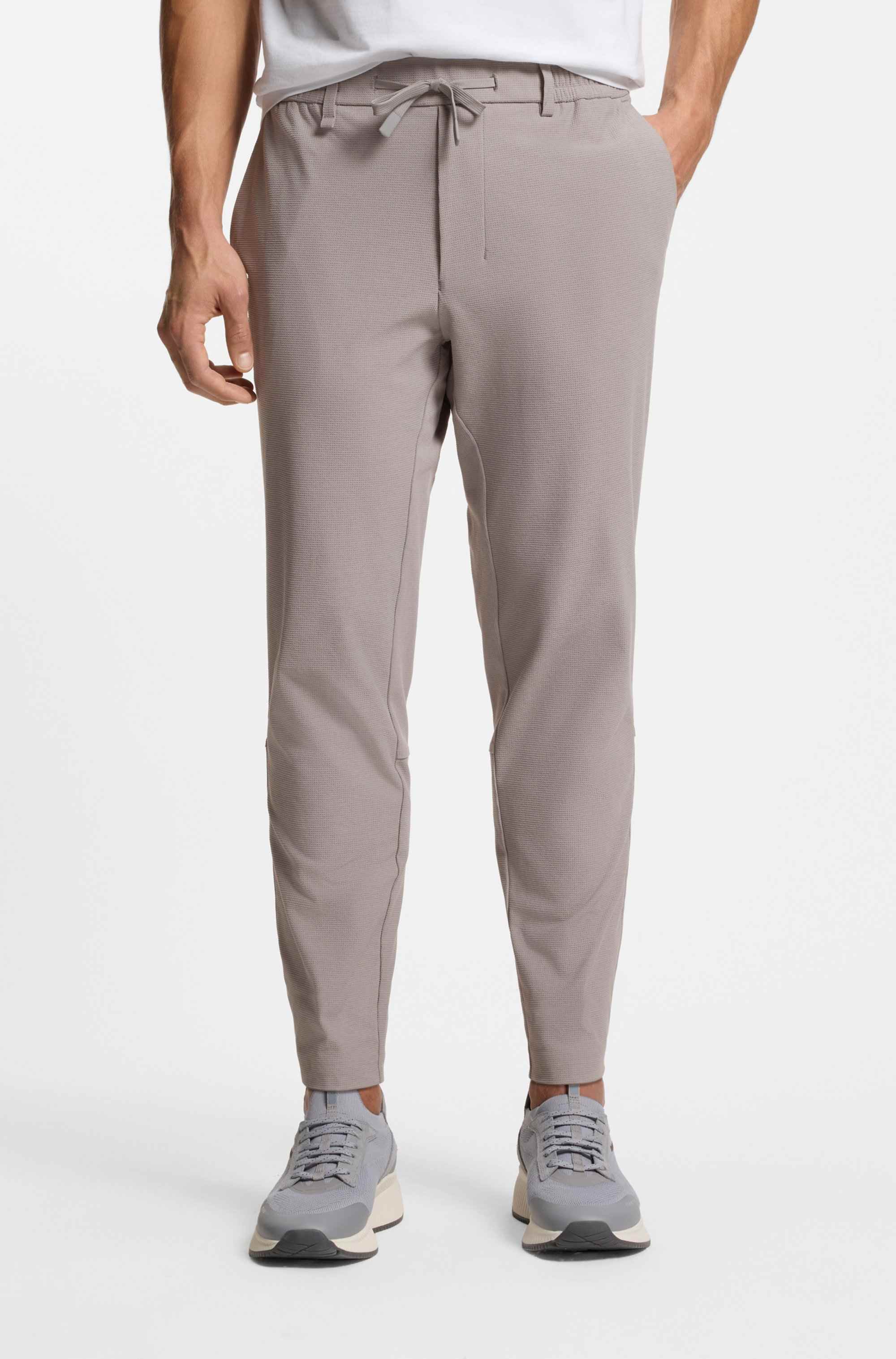 Tapered-fit trousers in waffle-structured stretch fabric