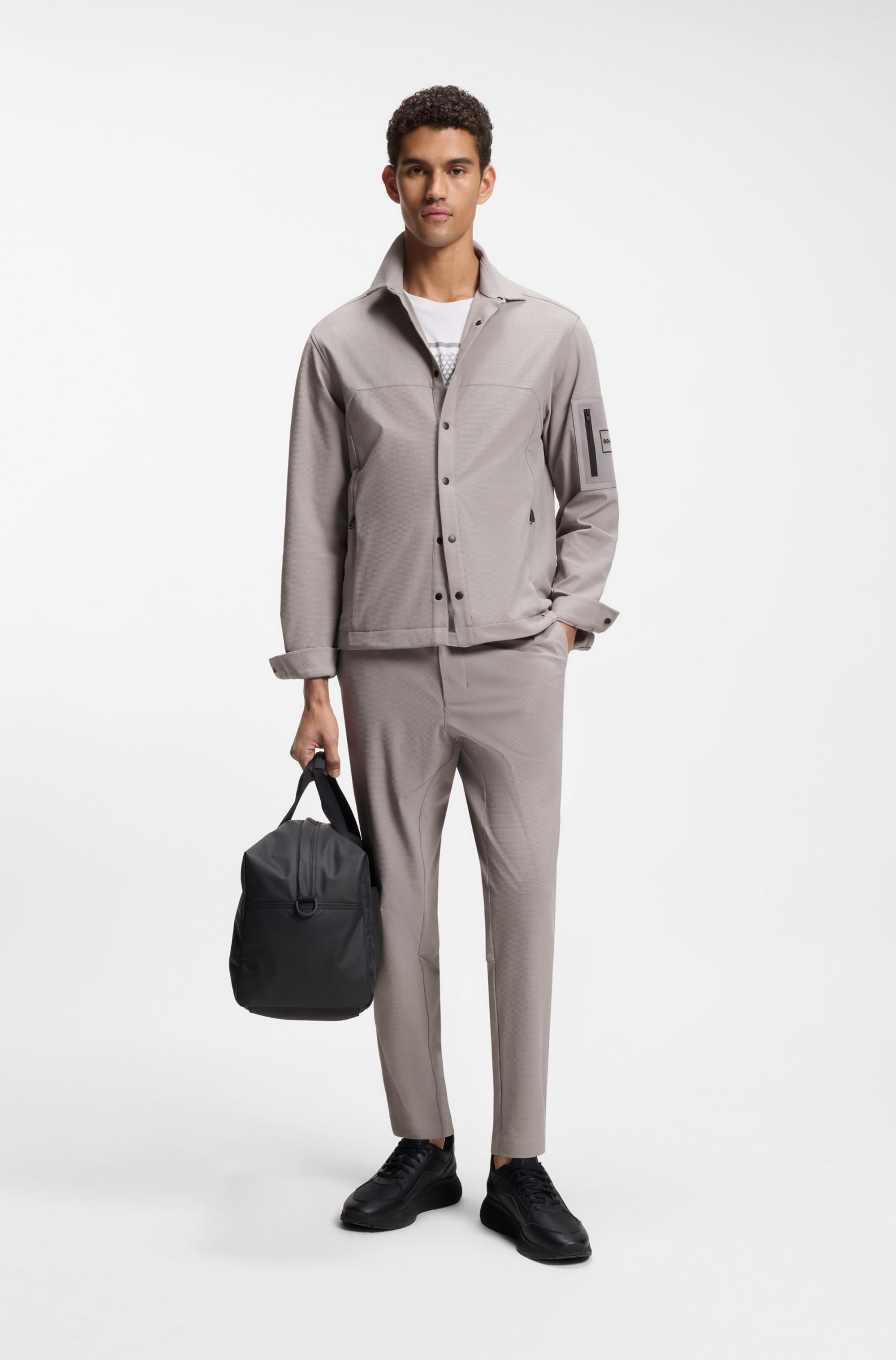 Tapered-fit trousers in waffle-structured stretch fabric