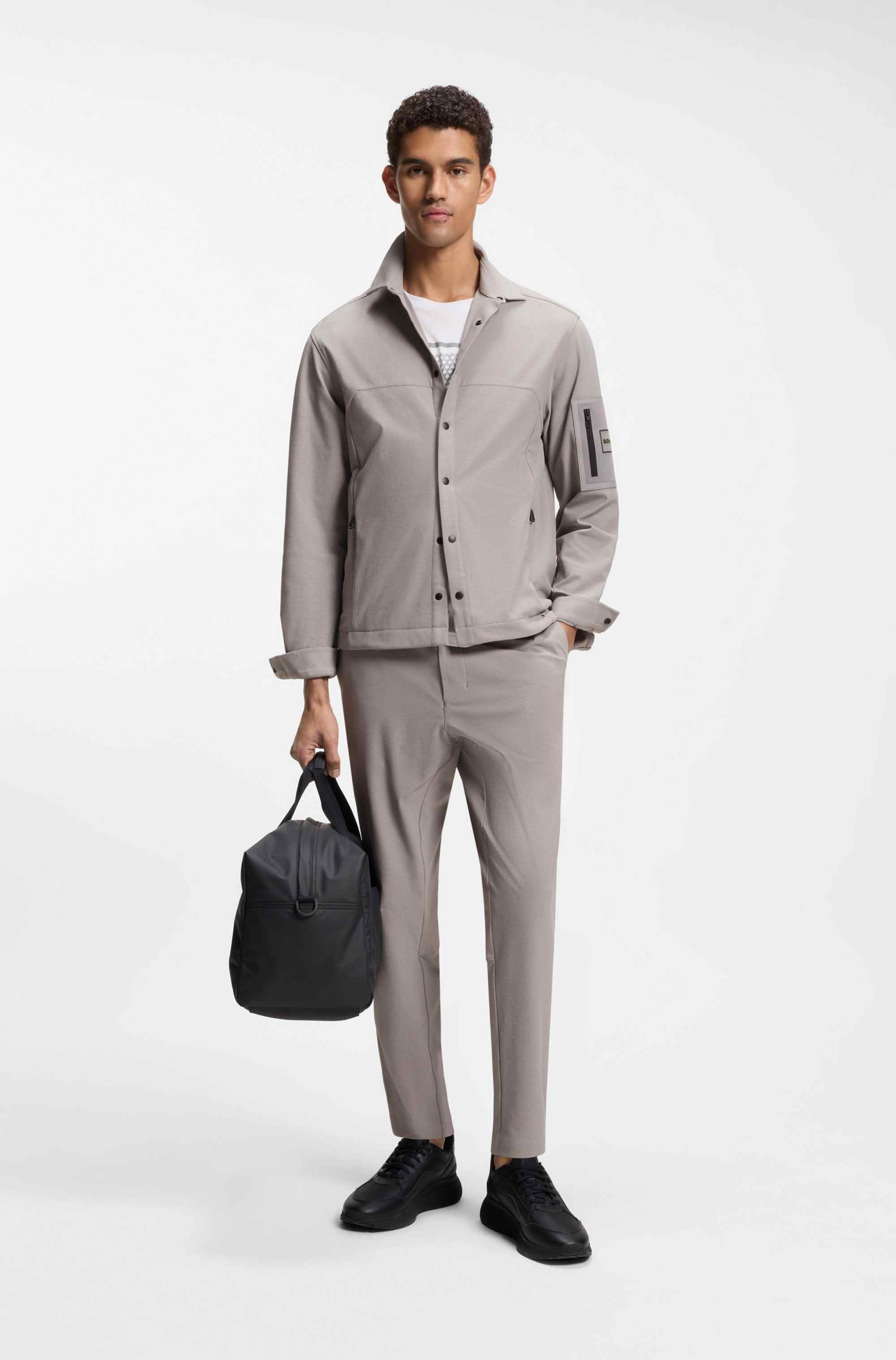 Tapered-fit trousers in waffle-structured stretch fabric