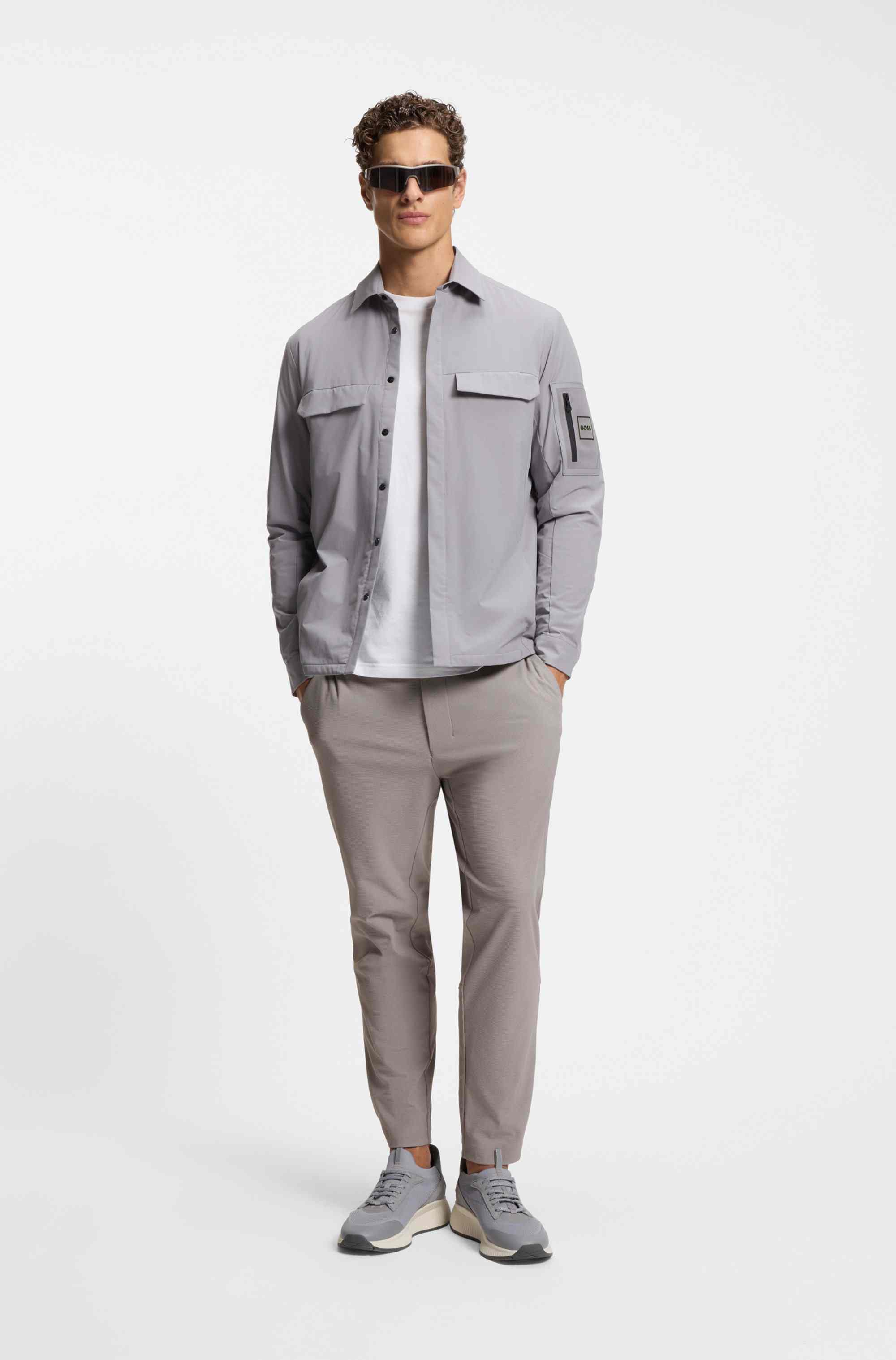 Tapered-fit trousers in waffle-structured stretch fabric