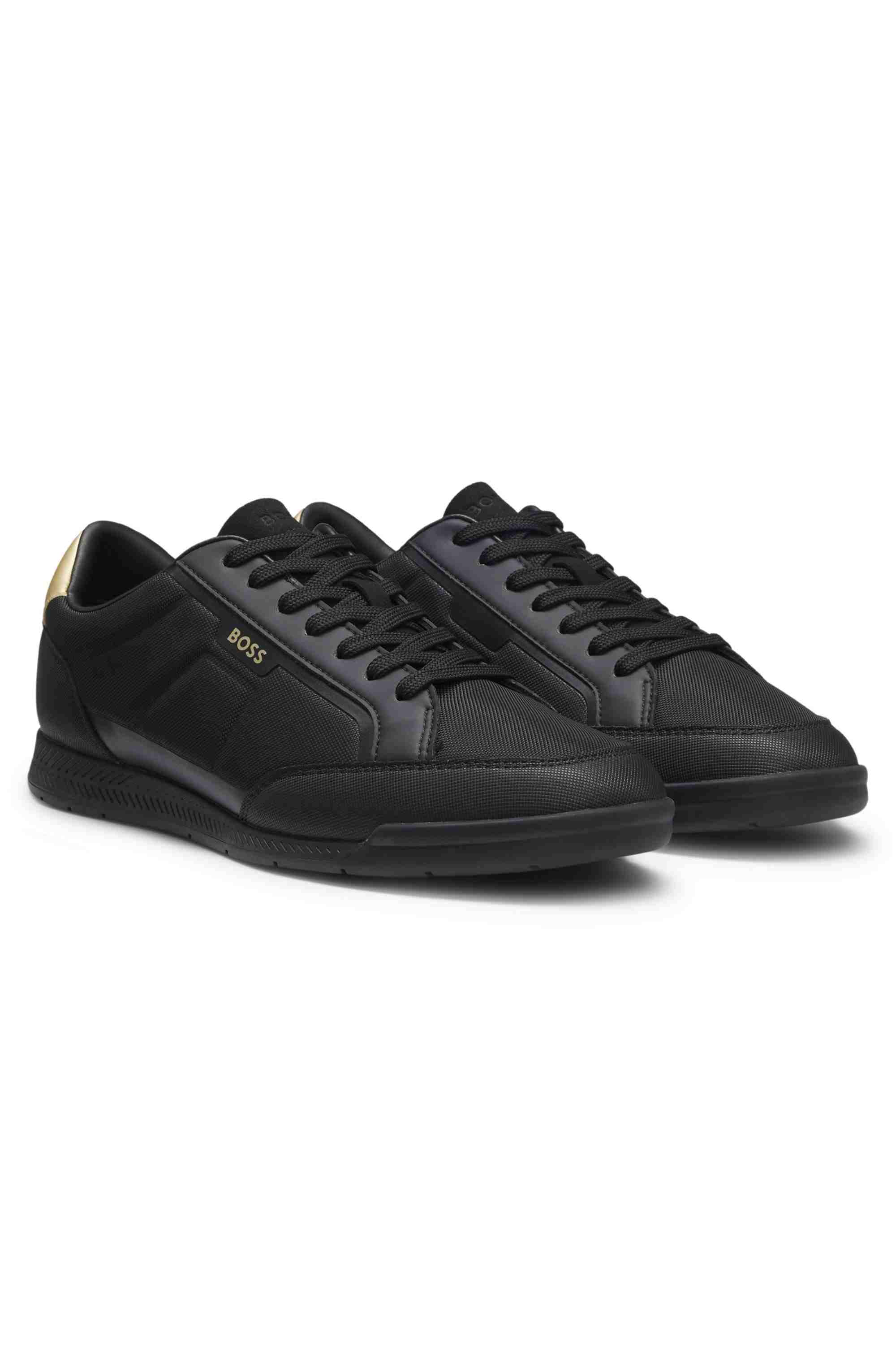Mixed-material trainers with contrast back tab
