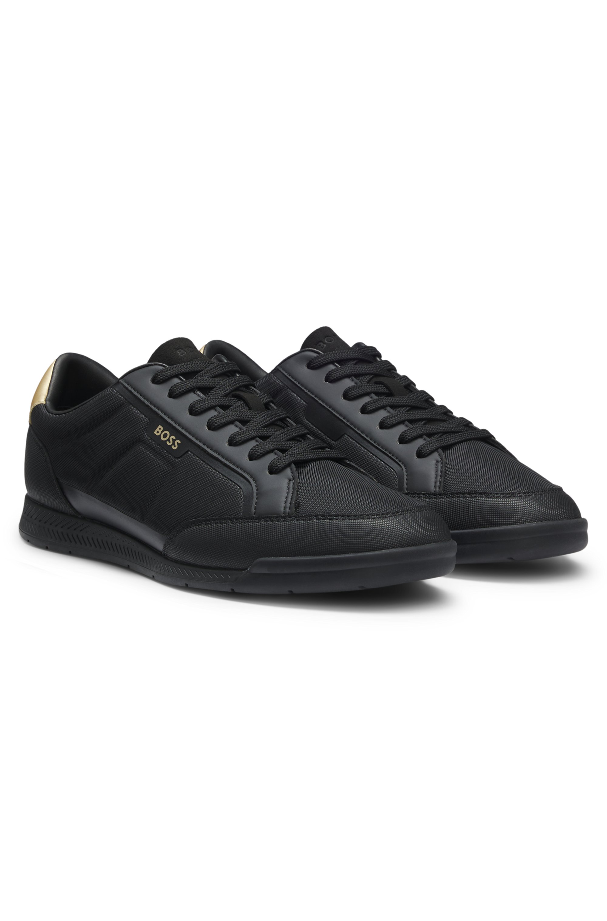 Mixed-material trainers with contrast back tab