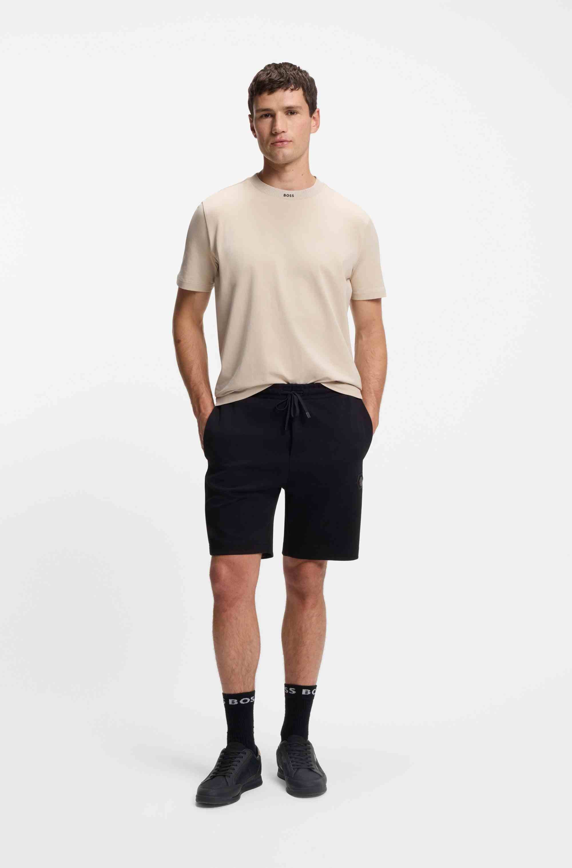 Mixed-material trainers with contrast back tab