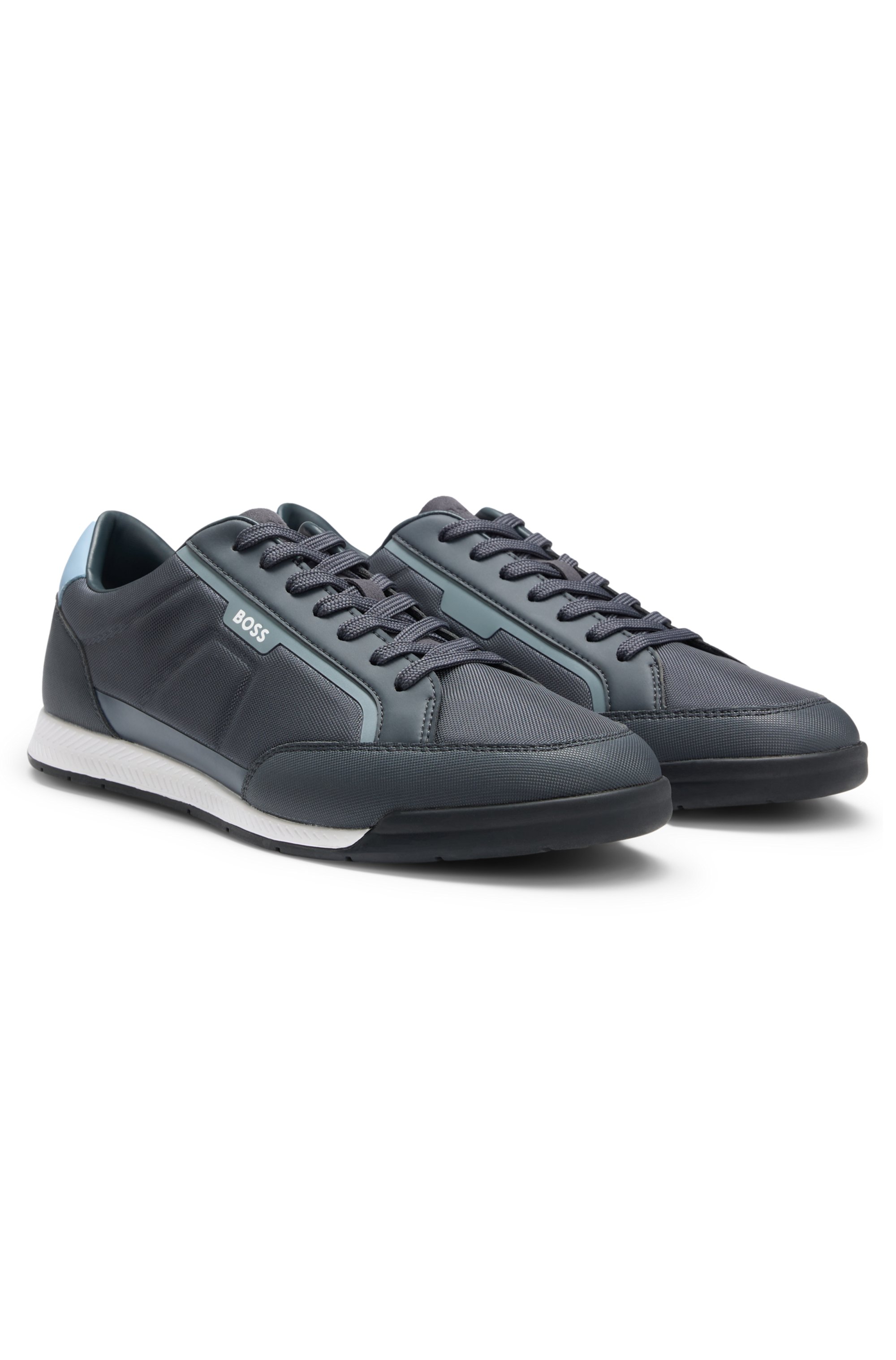 Mixed-material trainers with contrast back tab