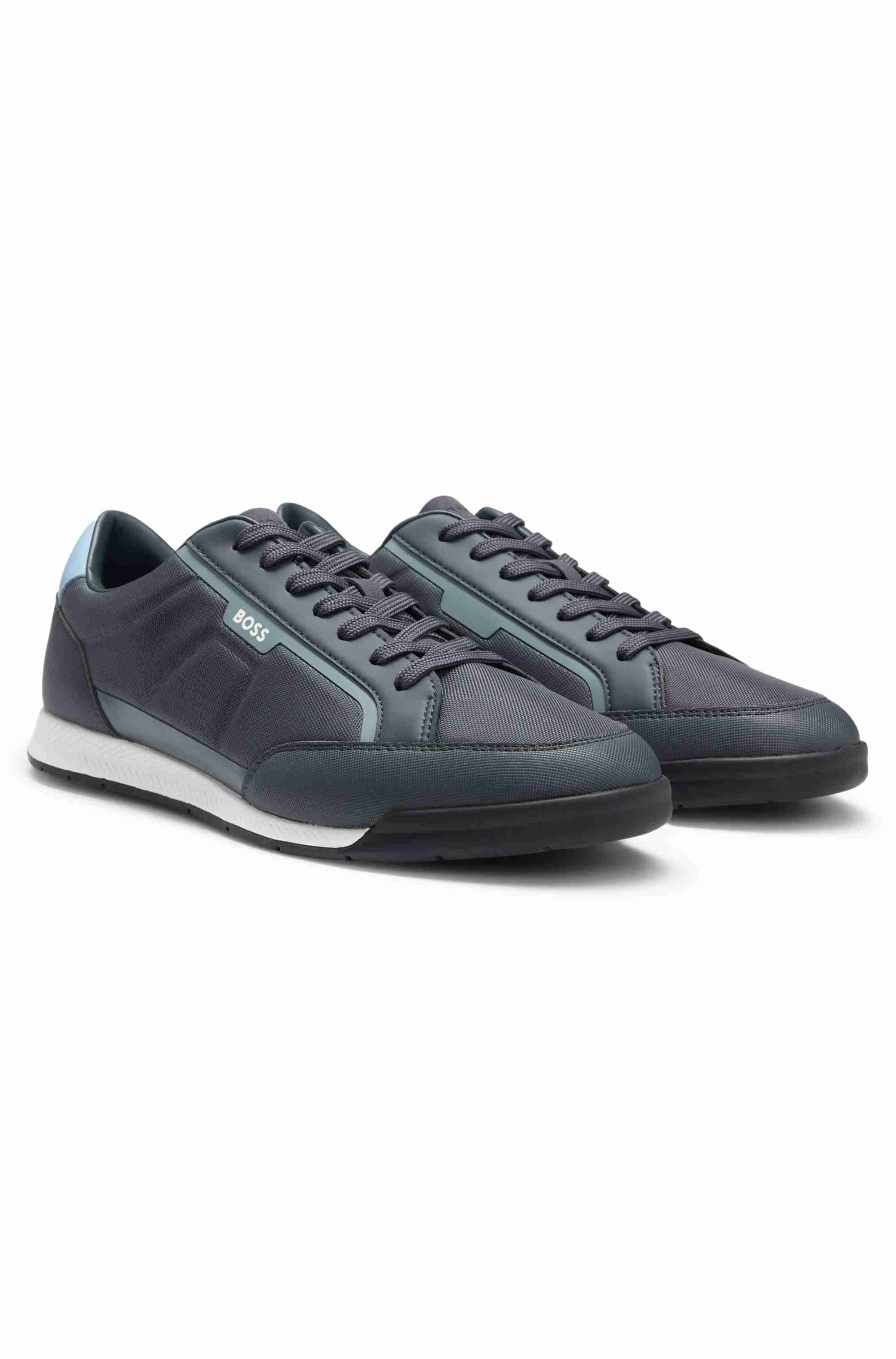Mixed-material trainers with contrast back tab