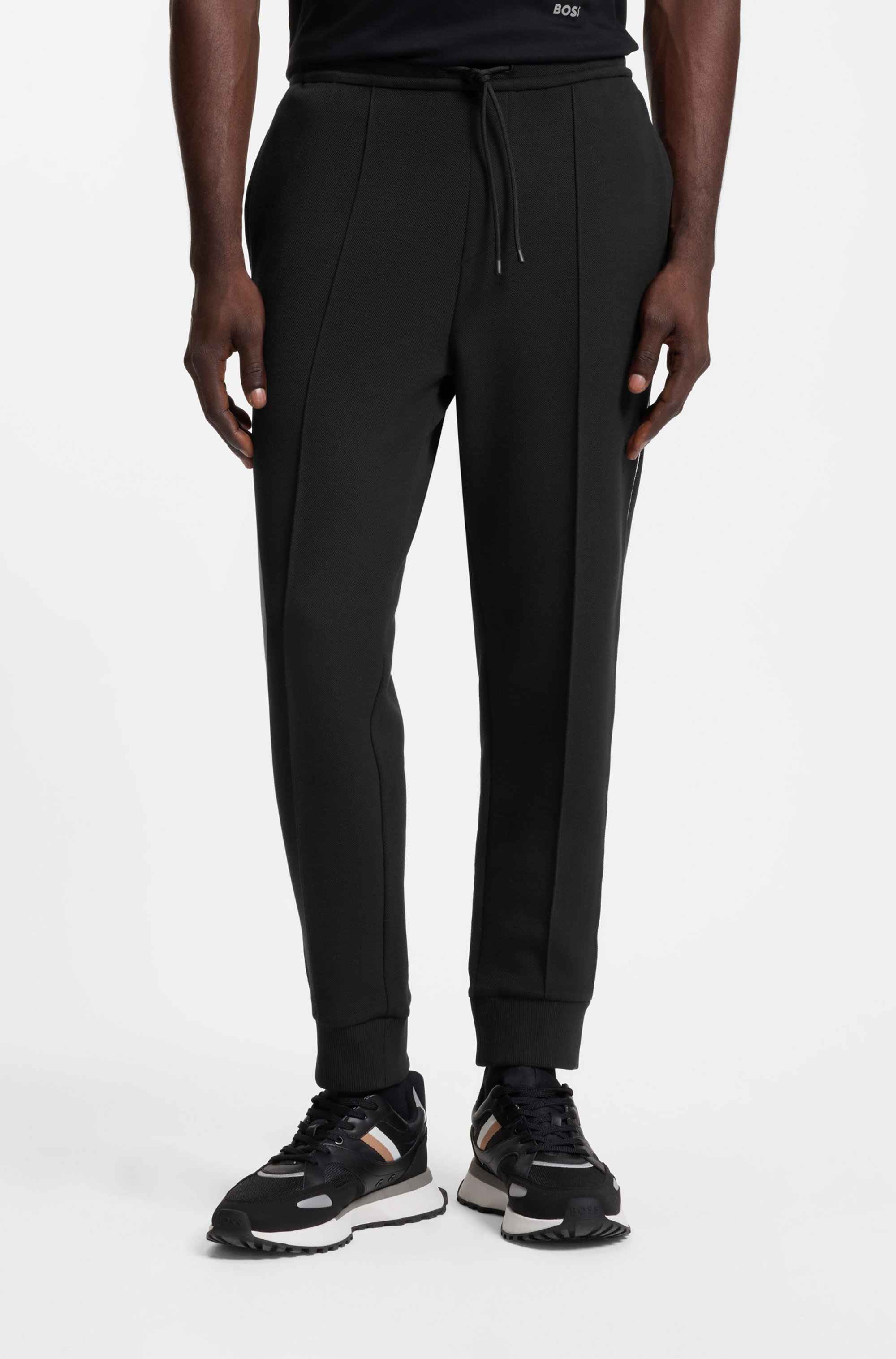 Cotton-blend tracksuit bottoms with piping details
