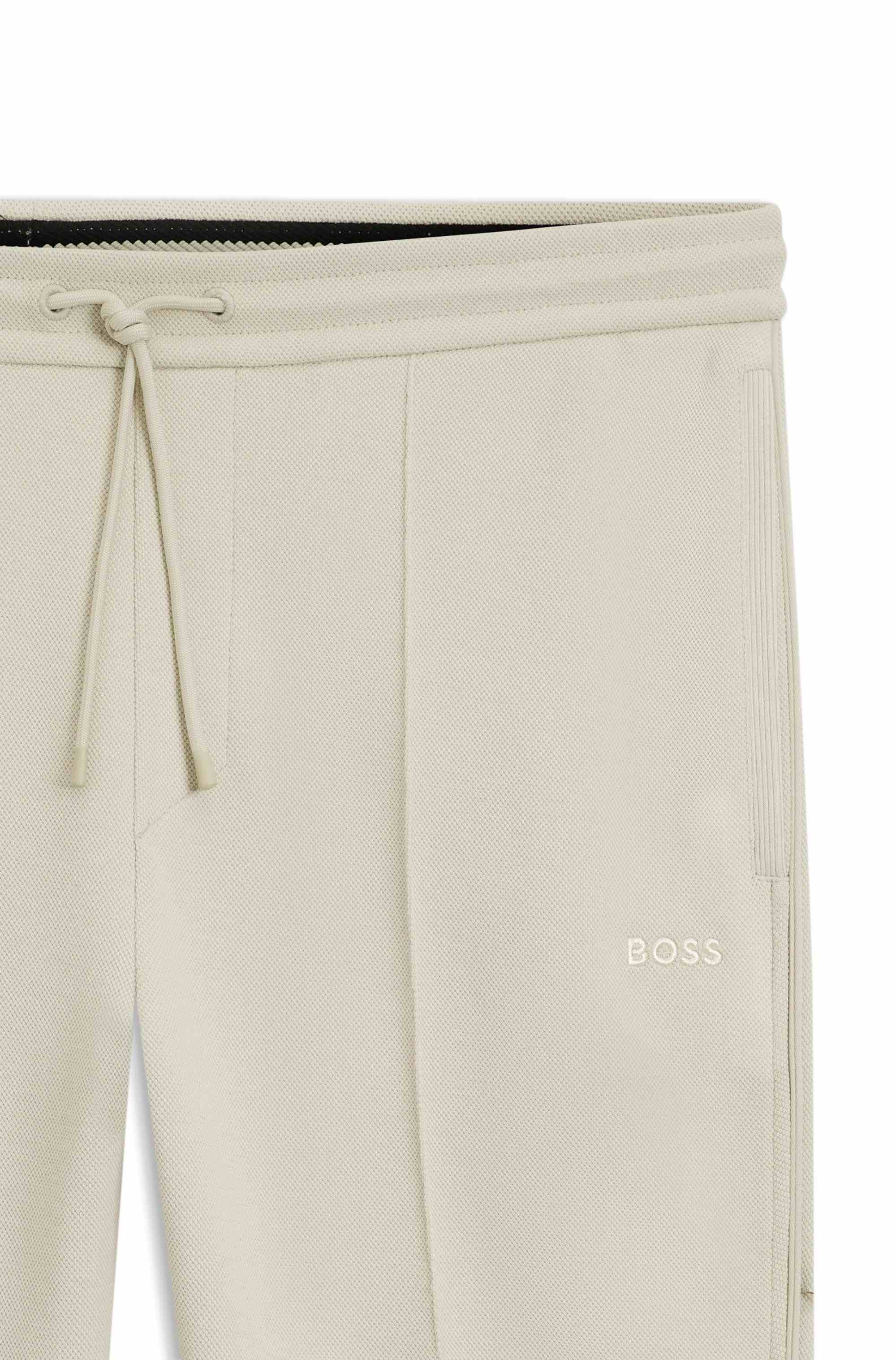 Cotton-blend tracksuit bottoms with piping details