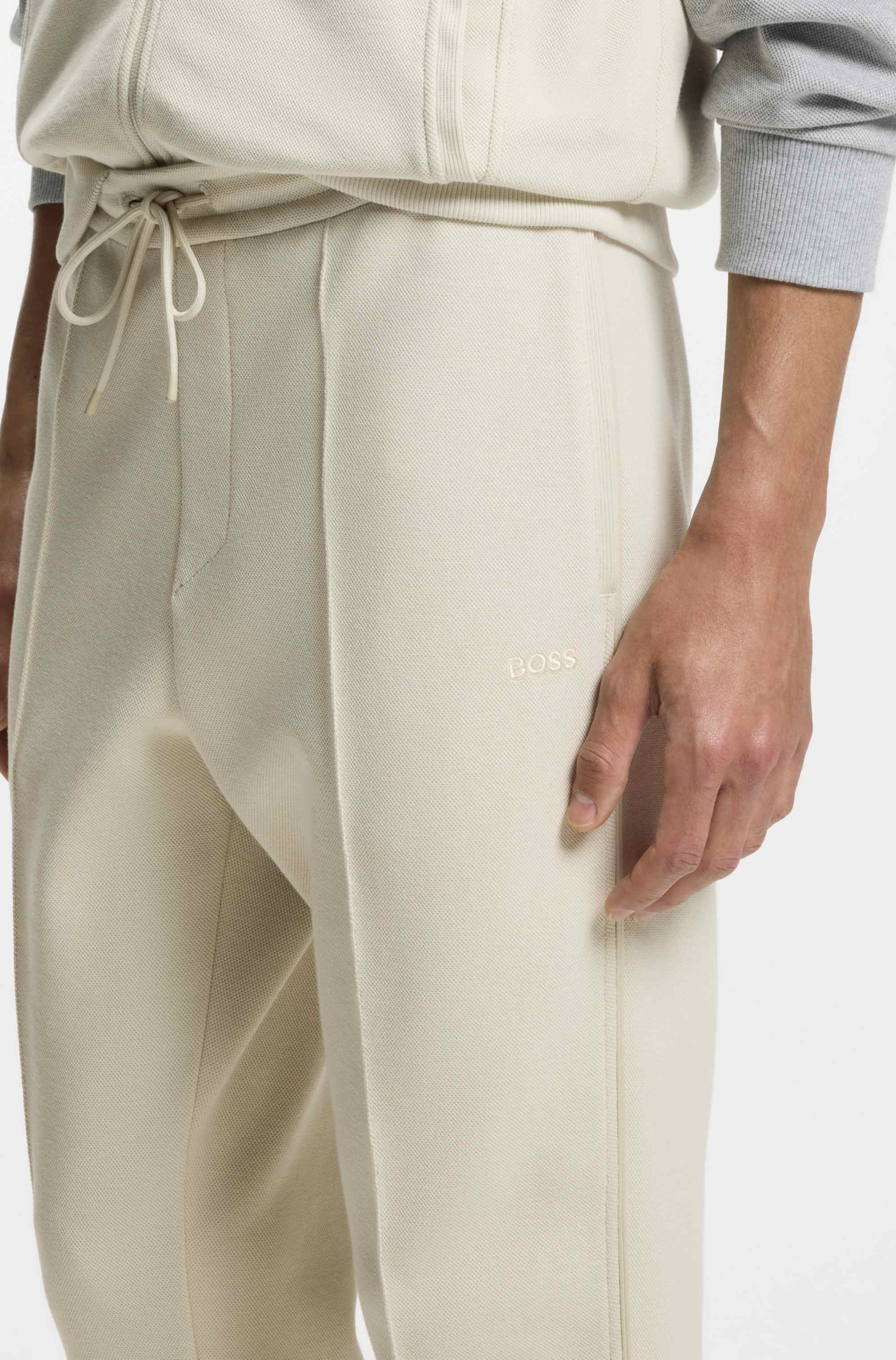 Cotton-blend tracksuit bottoms with piping details
