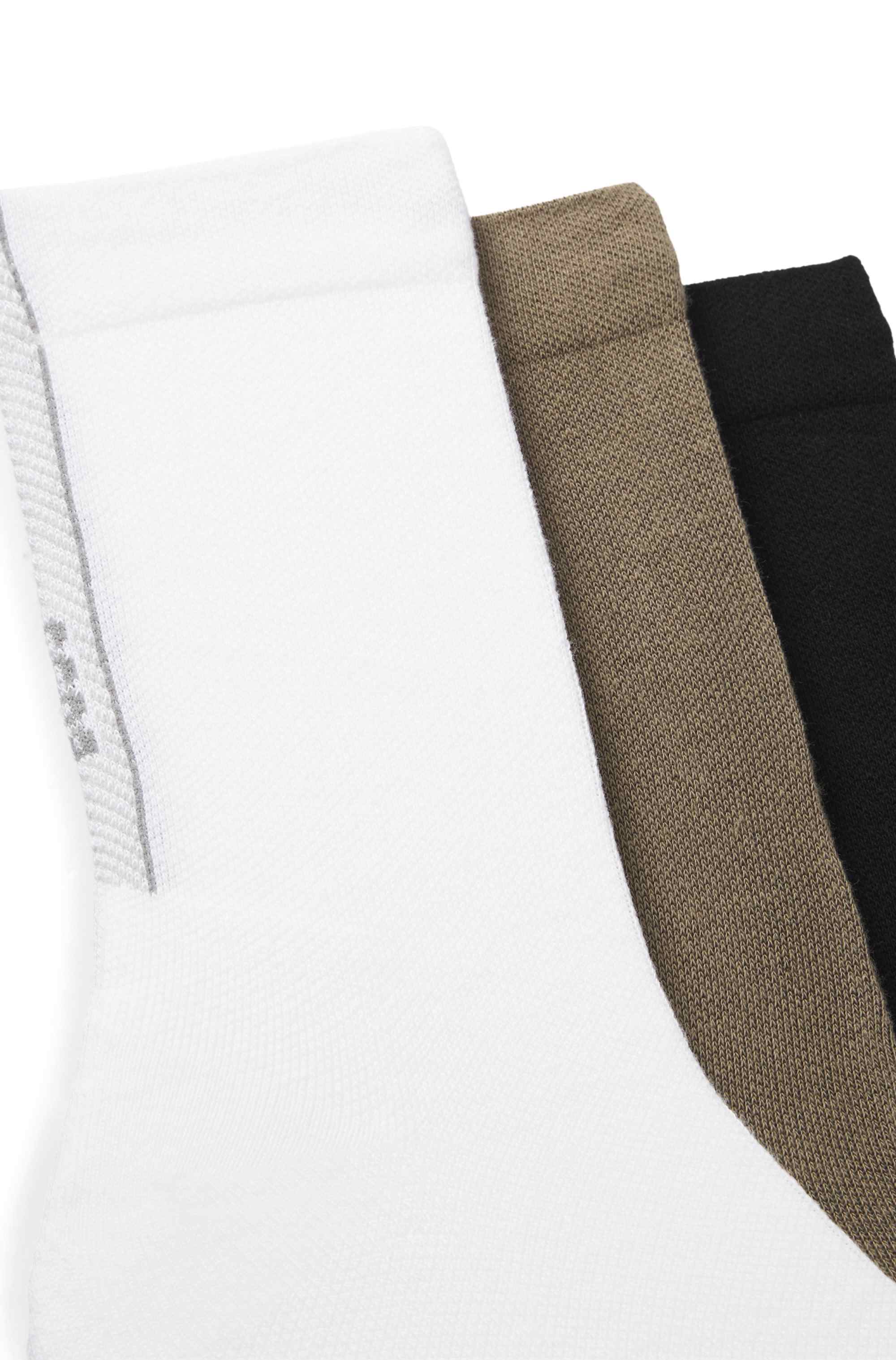 Three-pack of regular-length socks with structured tape