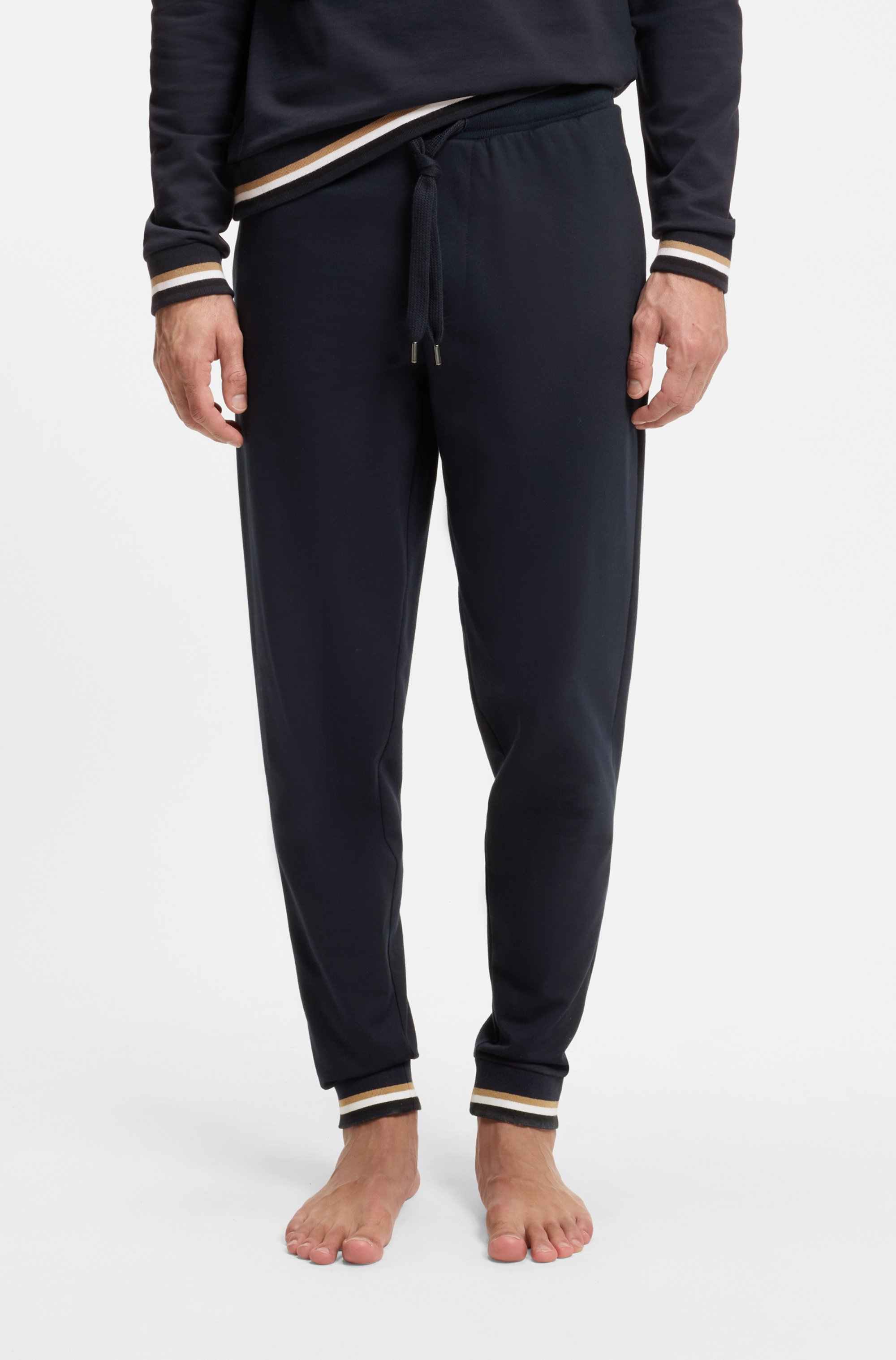 Cotton-terry tracksuit bottoms with logo and signature stripes