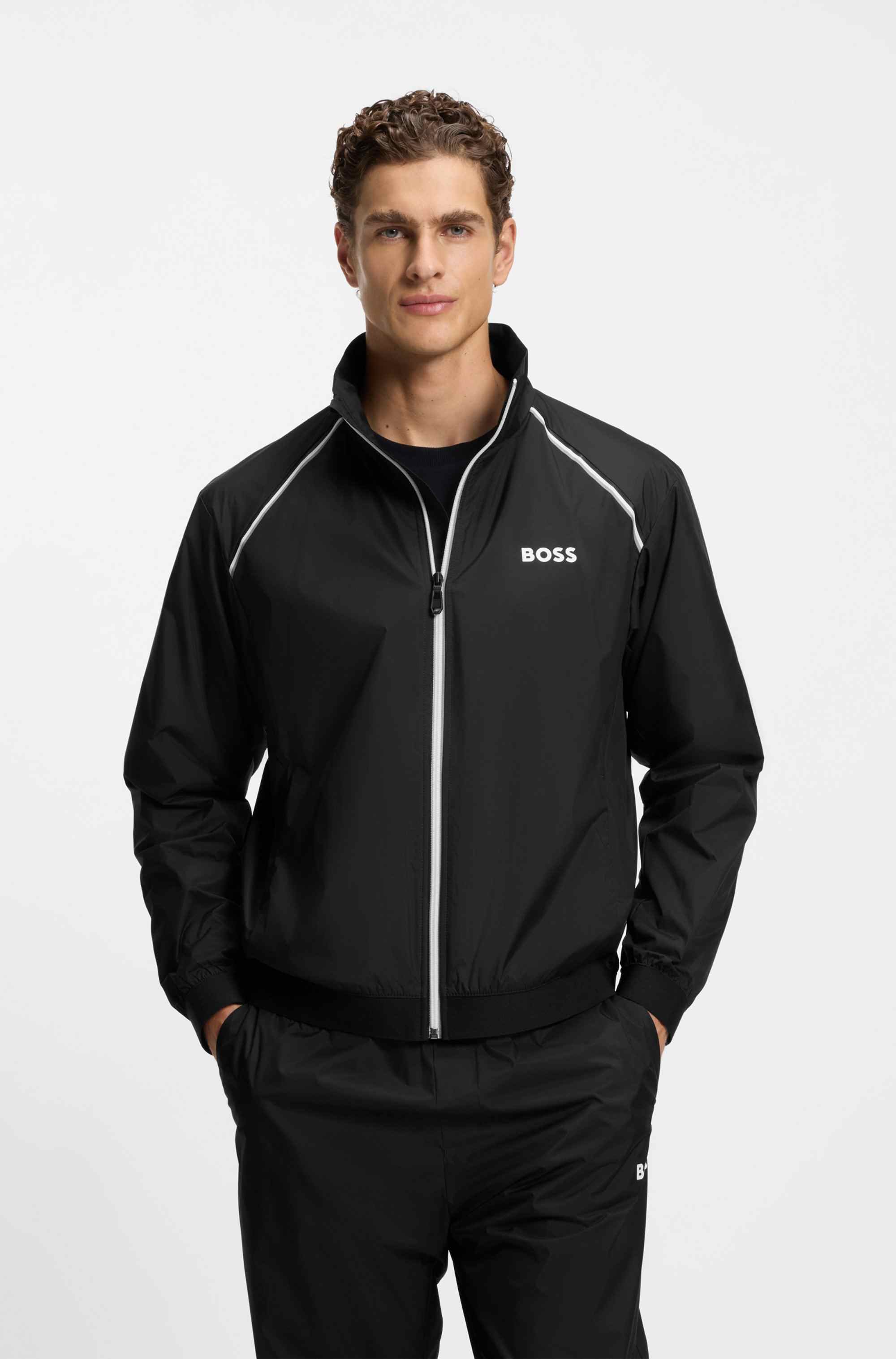 Active water-repellent two-piece tracksuit with zip hems