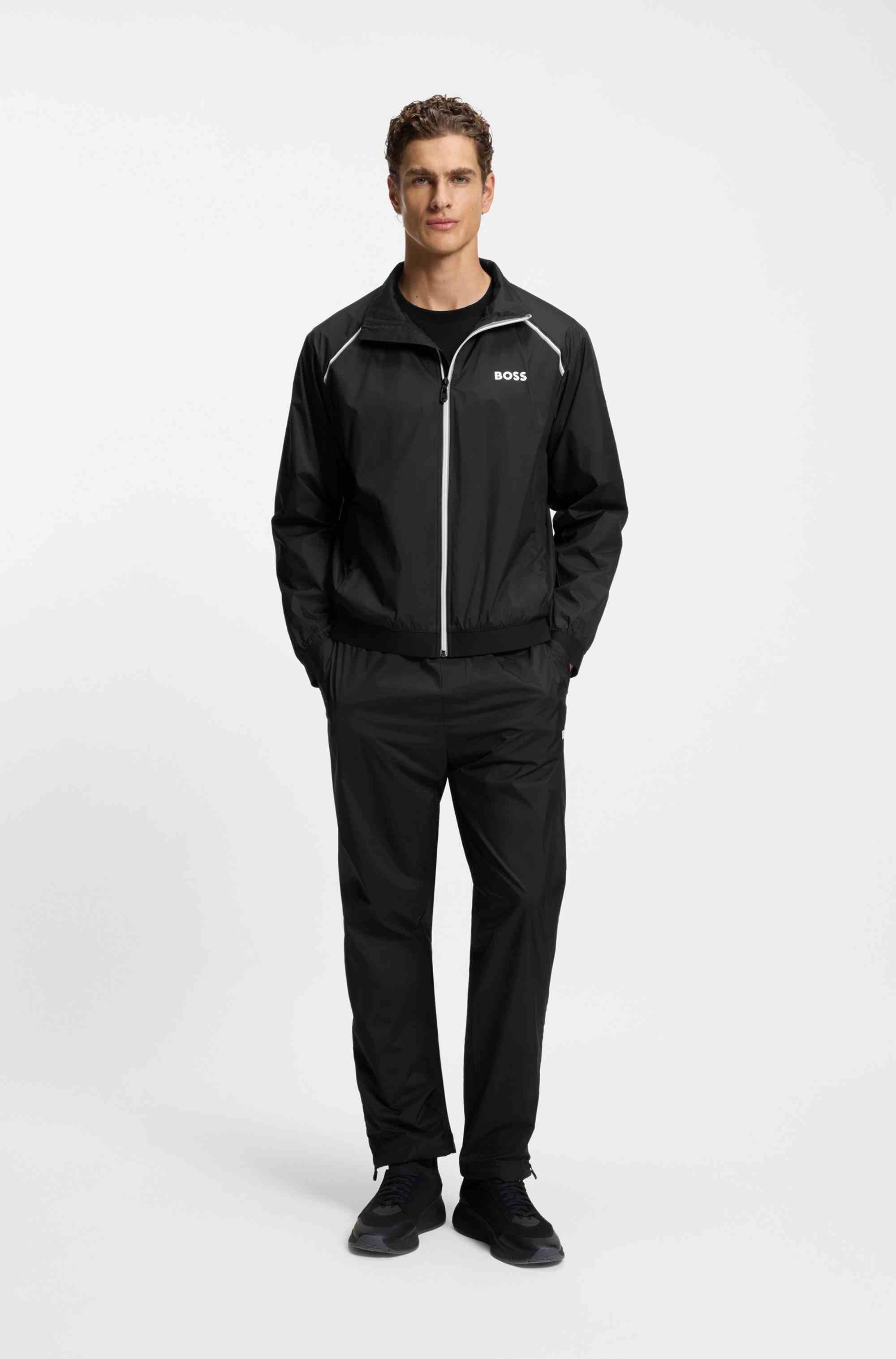 Active water-repellent two-piece tracksuit with zip hems