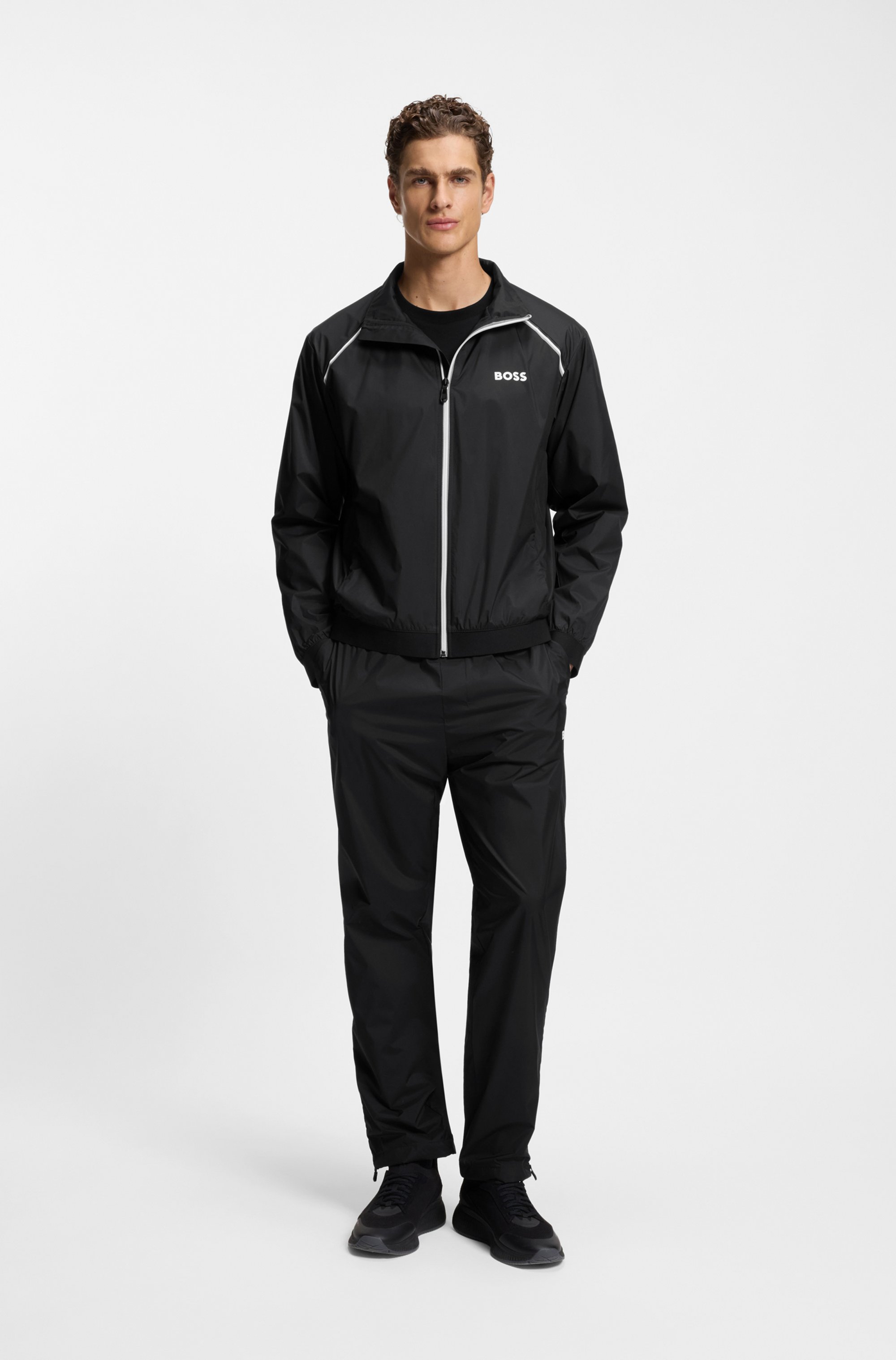 Active water-repellent two-piece tracksuit with zip hems