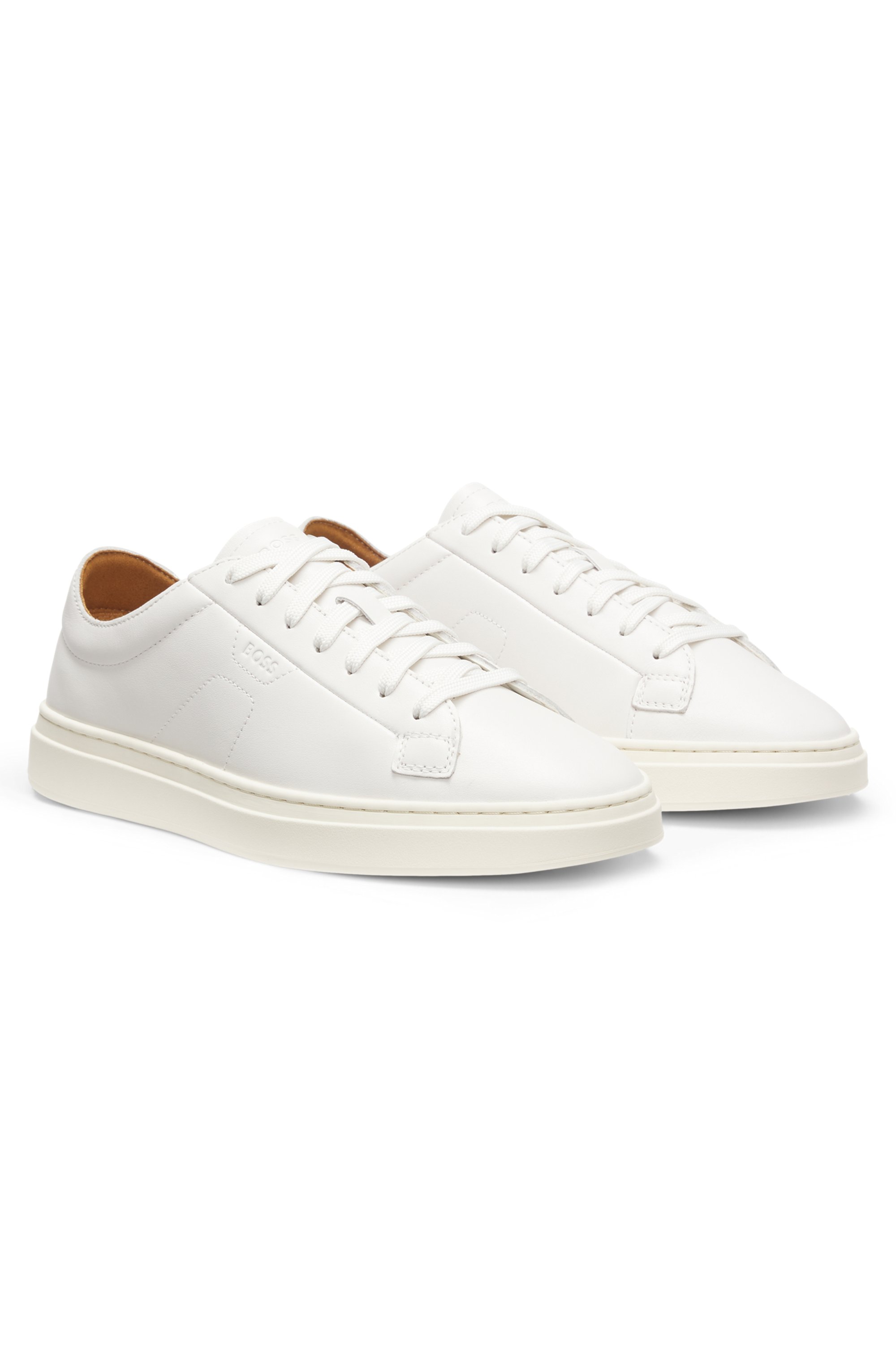 Low-top trainers in leather with embossed logo