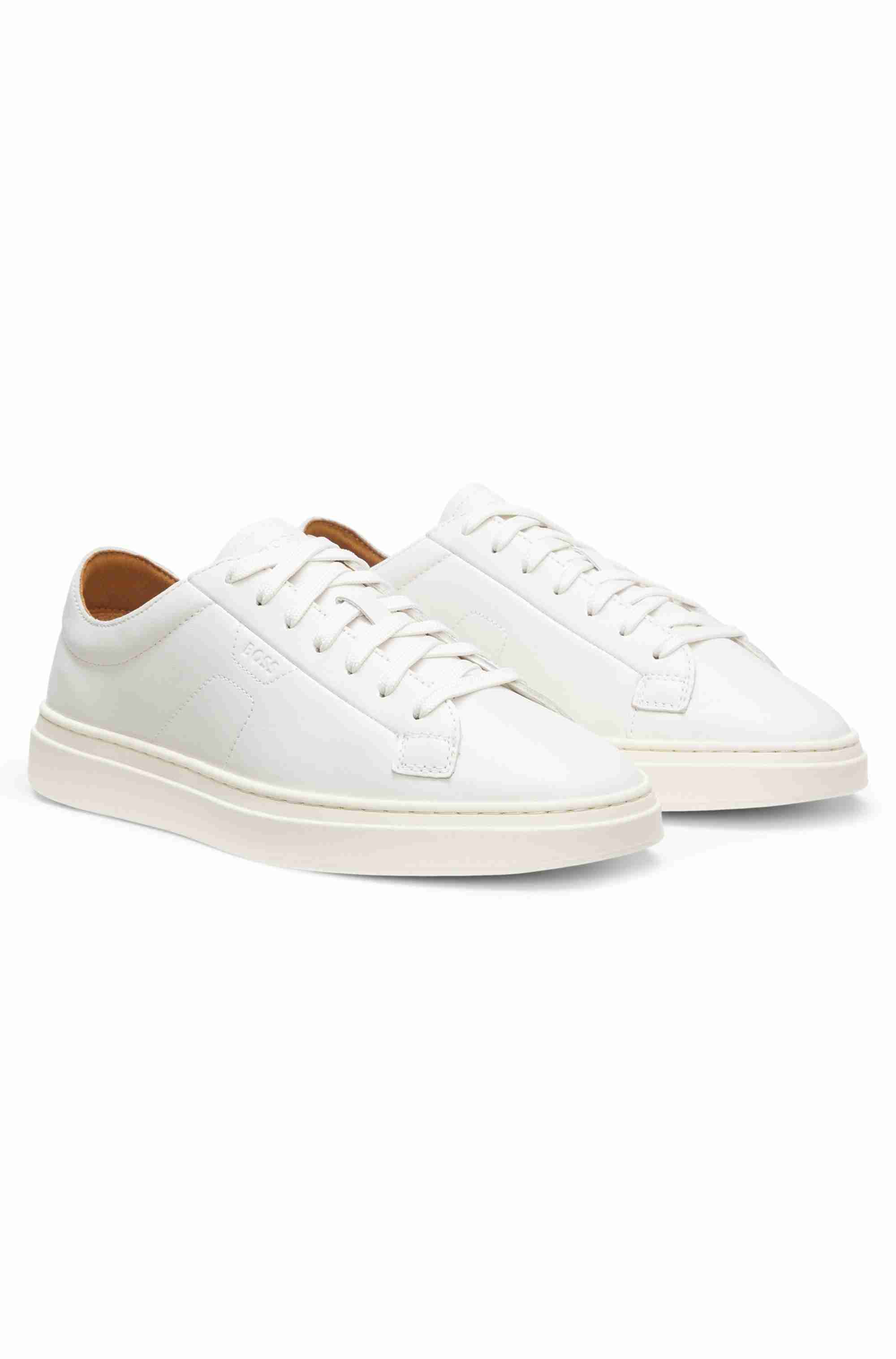 Low-top trainers in leather with embossed logo